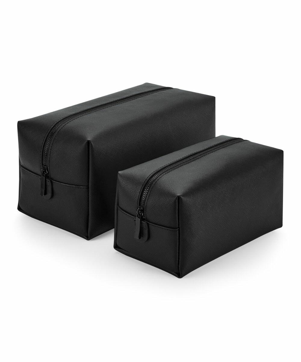 Two Bagbase BG749 black leather toiletry bags with zippers, one larger than the other, are placed side by side against a white background.
