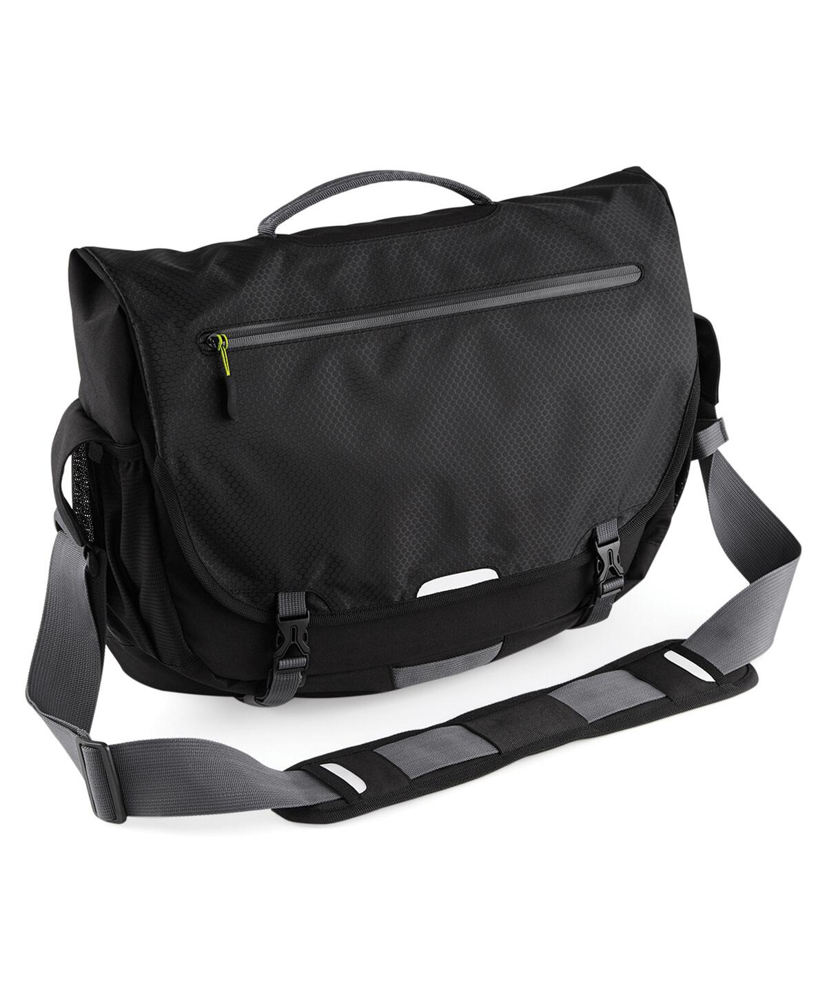 A black messenger bag with a textured surface, featuring a top handle, a front zippered pocket, buckle closures, and an adjustable shoulder strap with padded sections—Quadra QX570.
