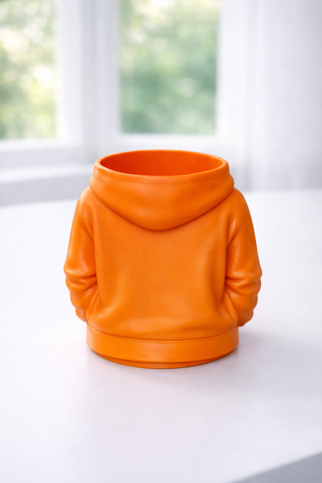 Image of the pen pot in orange showing the back