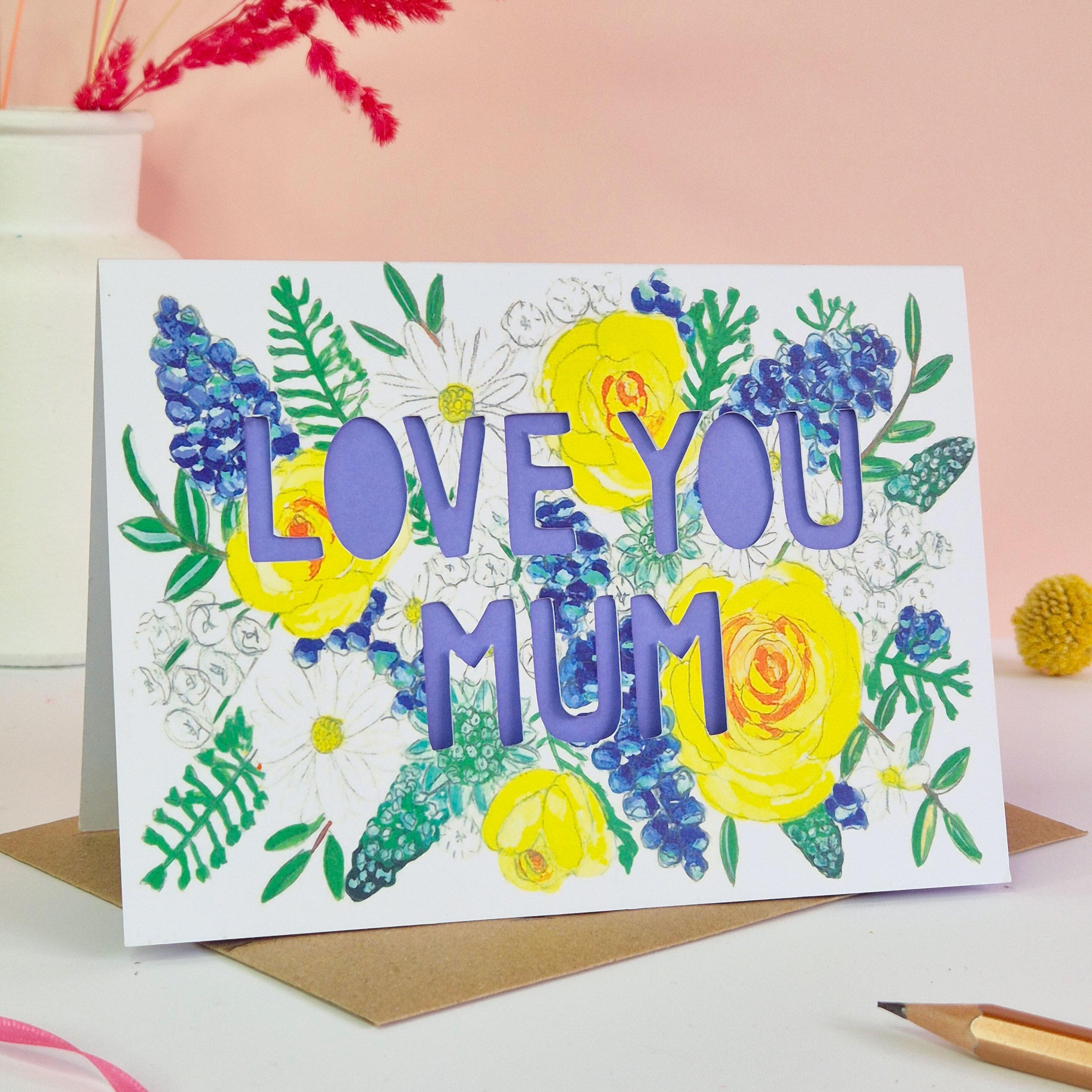 Card with 'Love you mum' in paper cut text with dark lilac liner