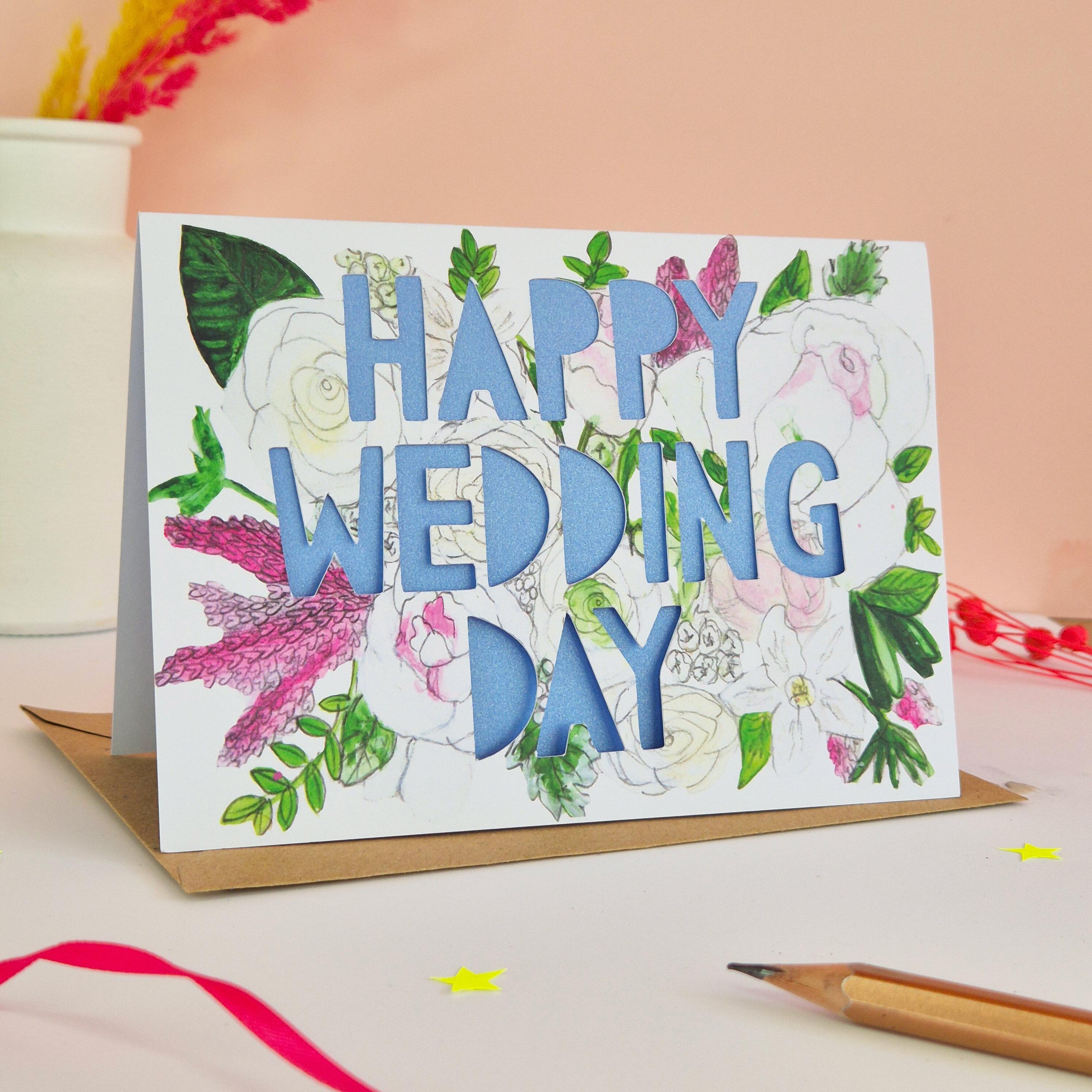 White and Pink floral illustration card with Happy Wedding Day paper cut text and shimmering blue paper liner