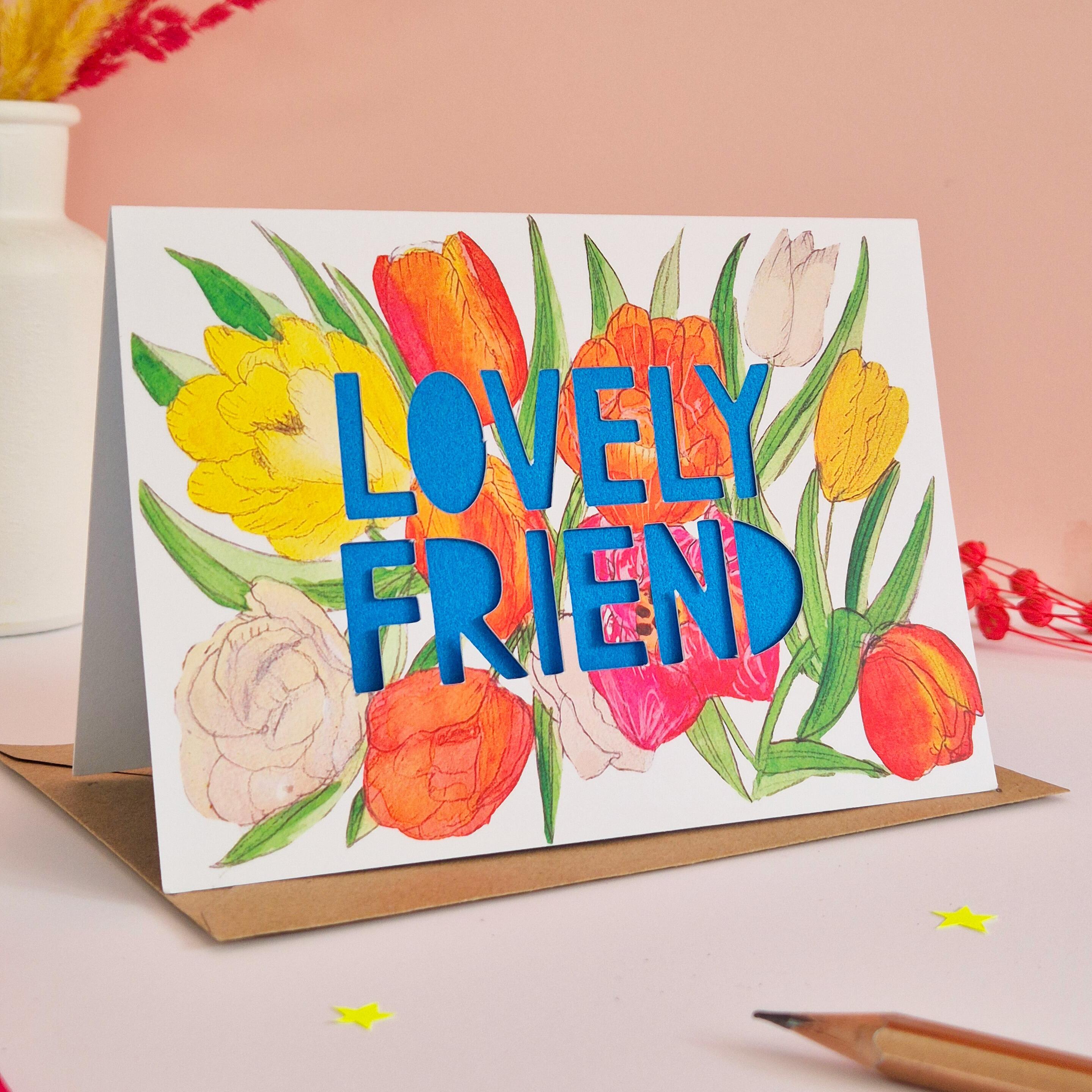 Tulip illustration card with Lovely Friend die cut text and bright blue paper liner