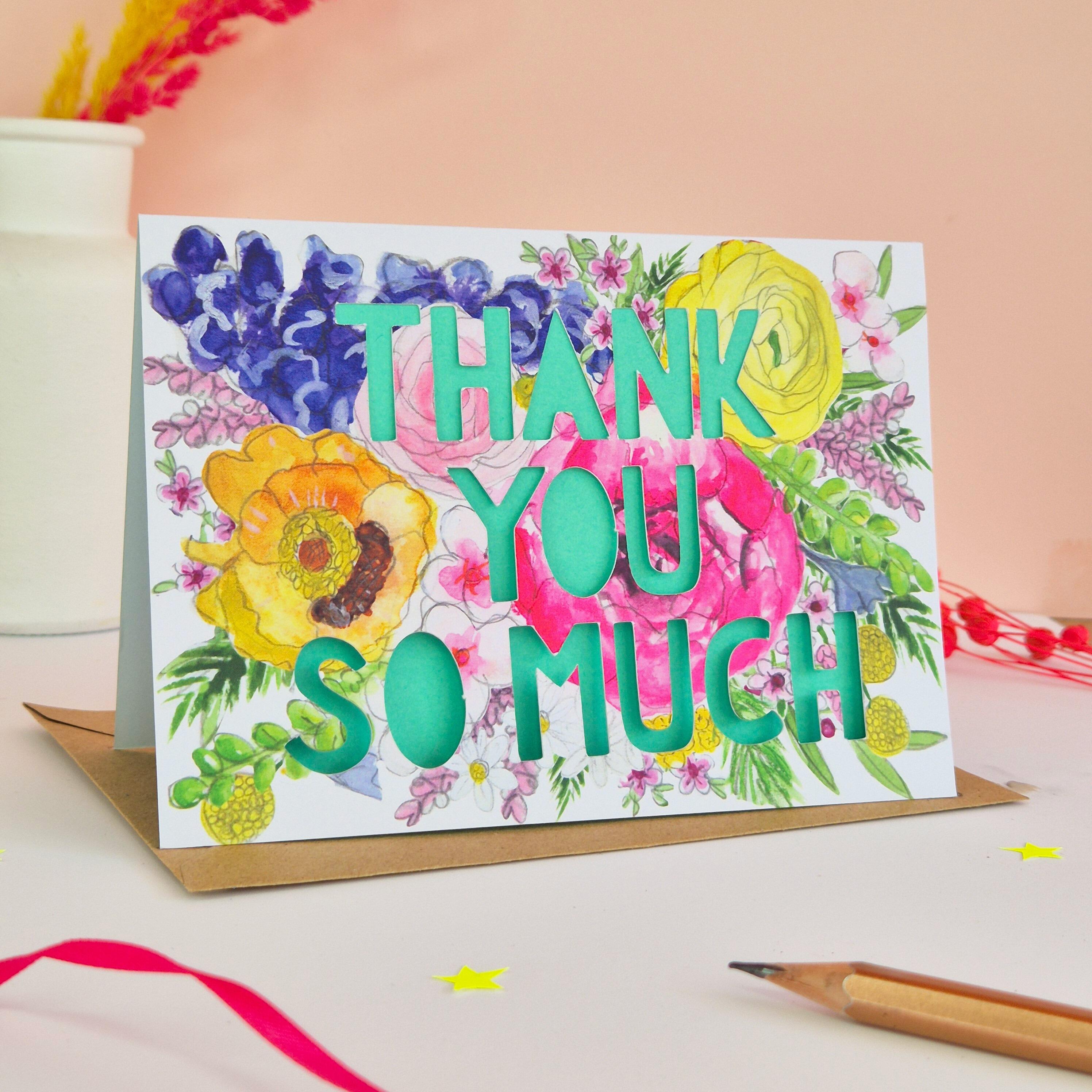 Bright floral illustration card with Thank you so much die cut text and turquois paper liner