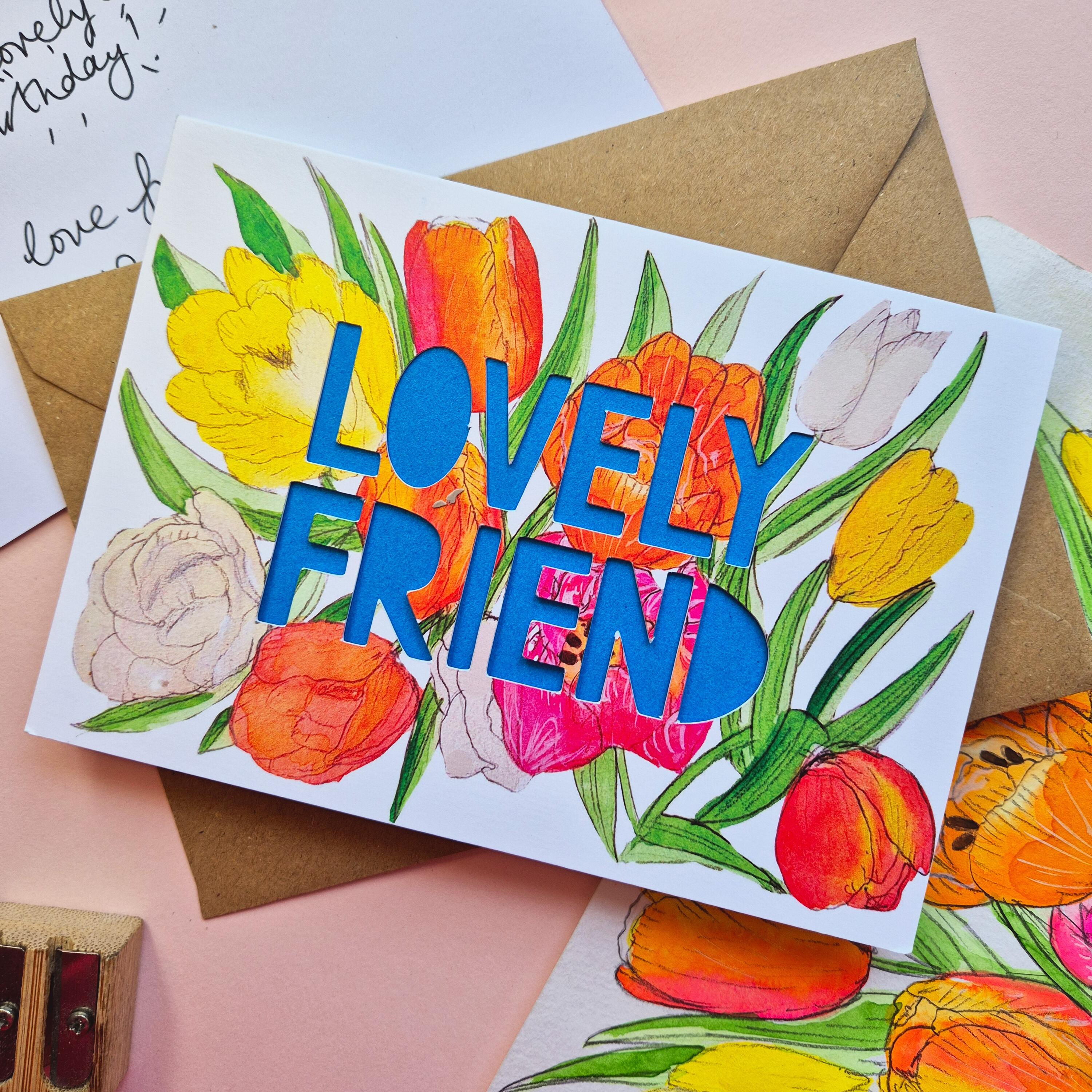 Tulip illustration card with Lovely Friend die cut text and bright blue paper liner
