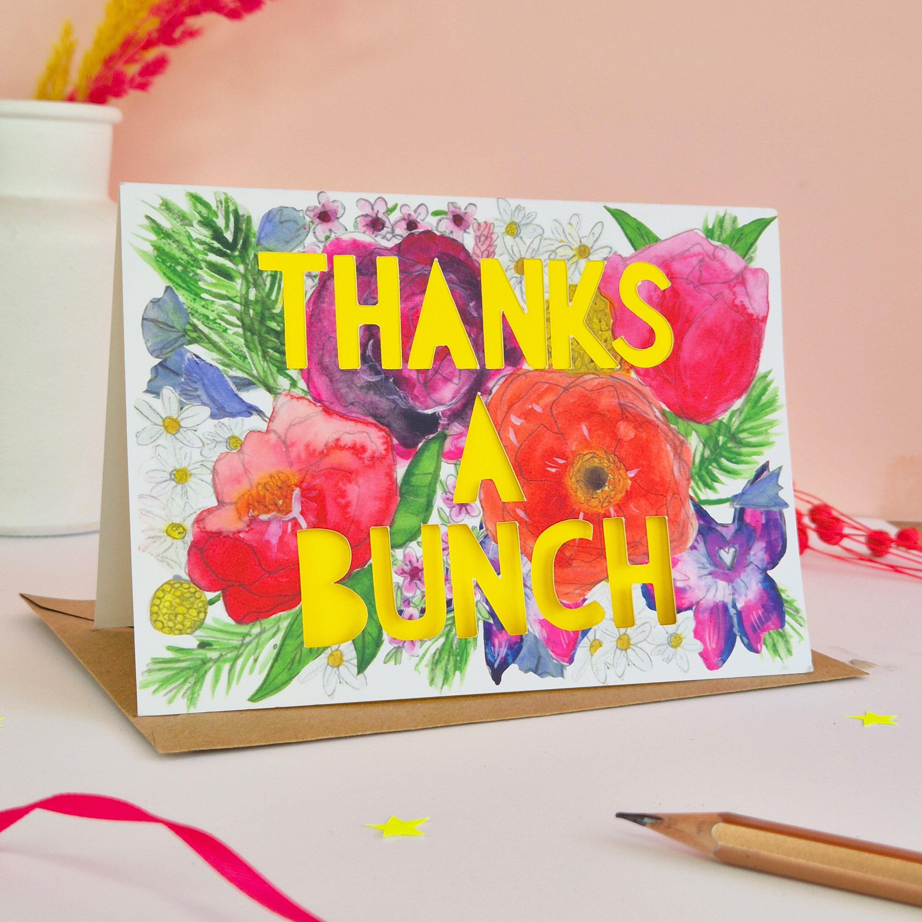 beautifully bright floral illustration thank you card with thanks a bunch die cut text and bright yellow paper liner