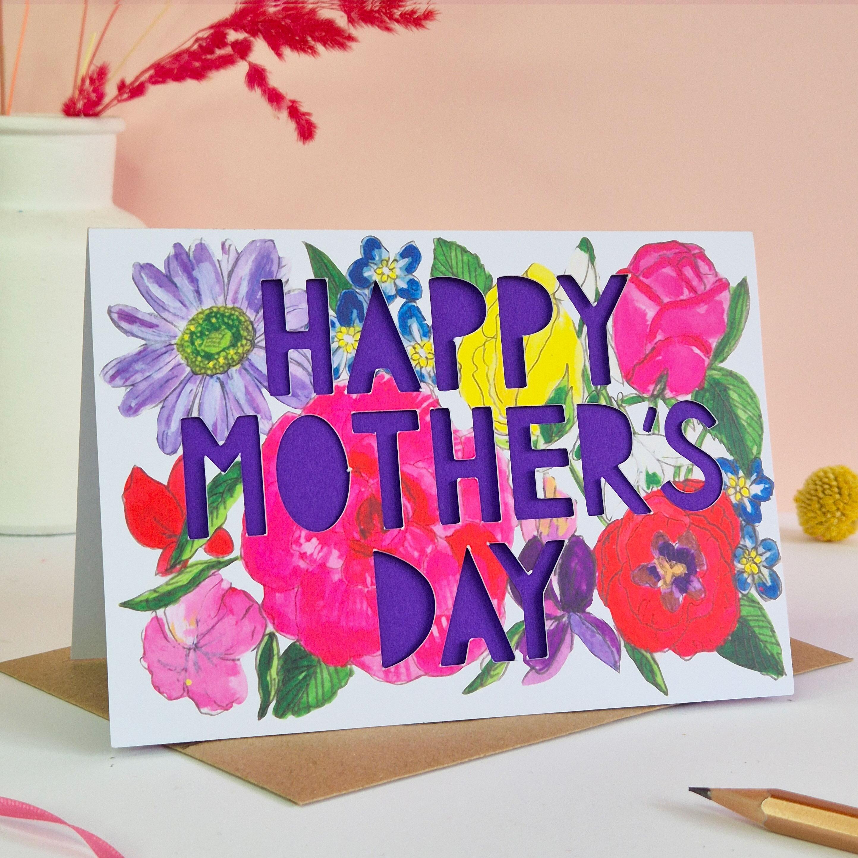 Bright floral Mother's Day card with purple paper cut lettering