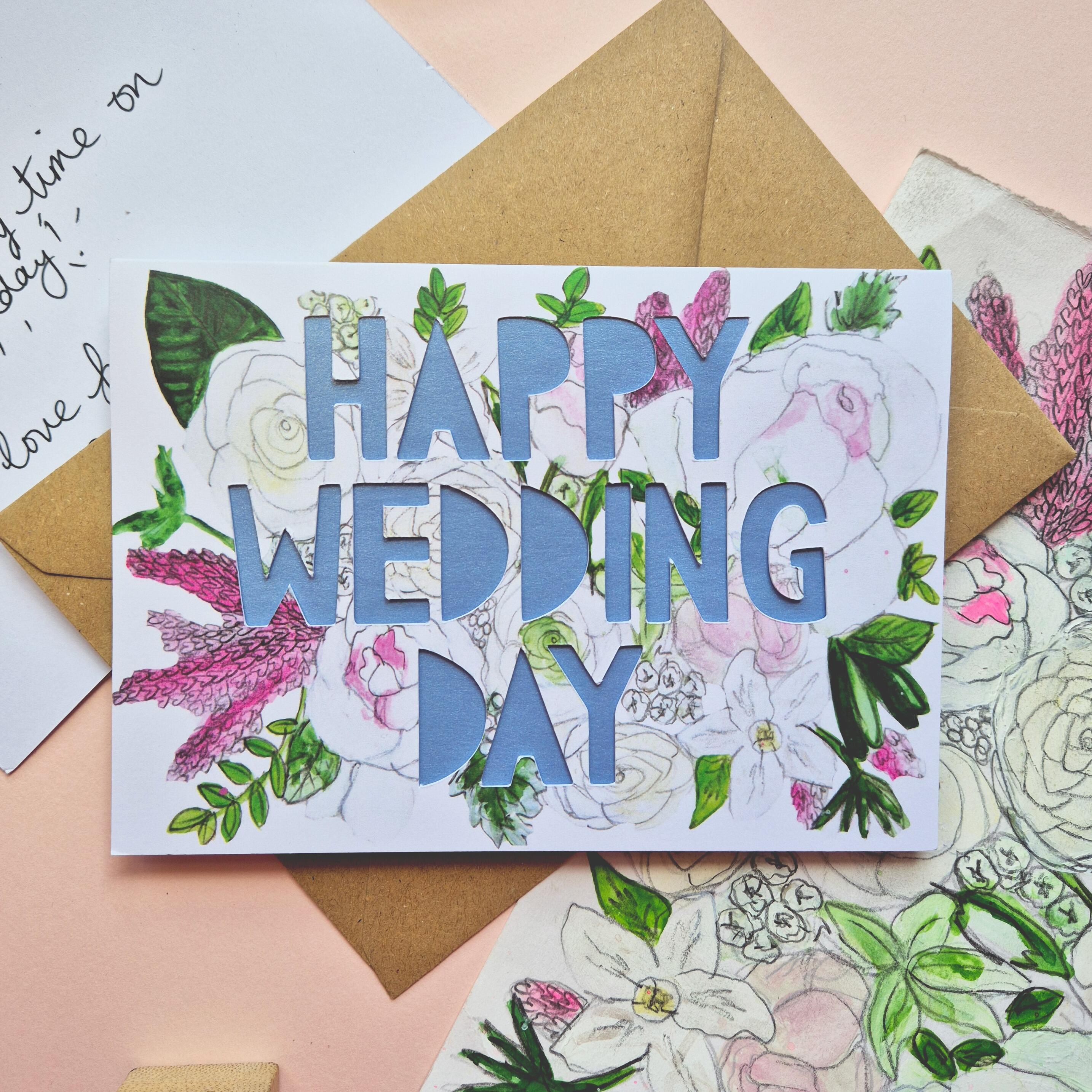 White and Pink floral illustration card with Happy Wedding Day paper cut text and shimmering blue paper liner
