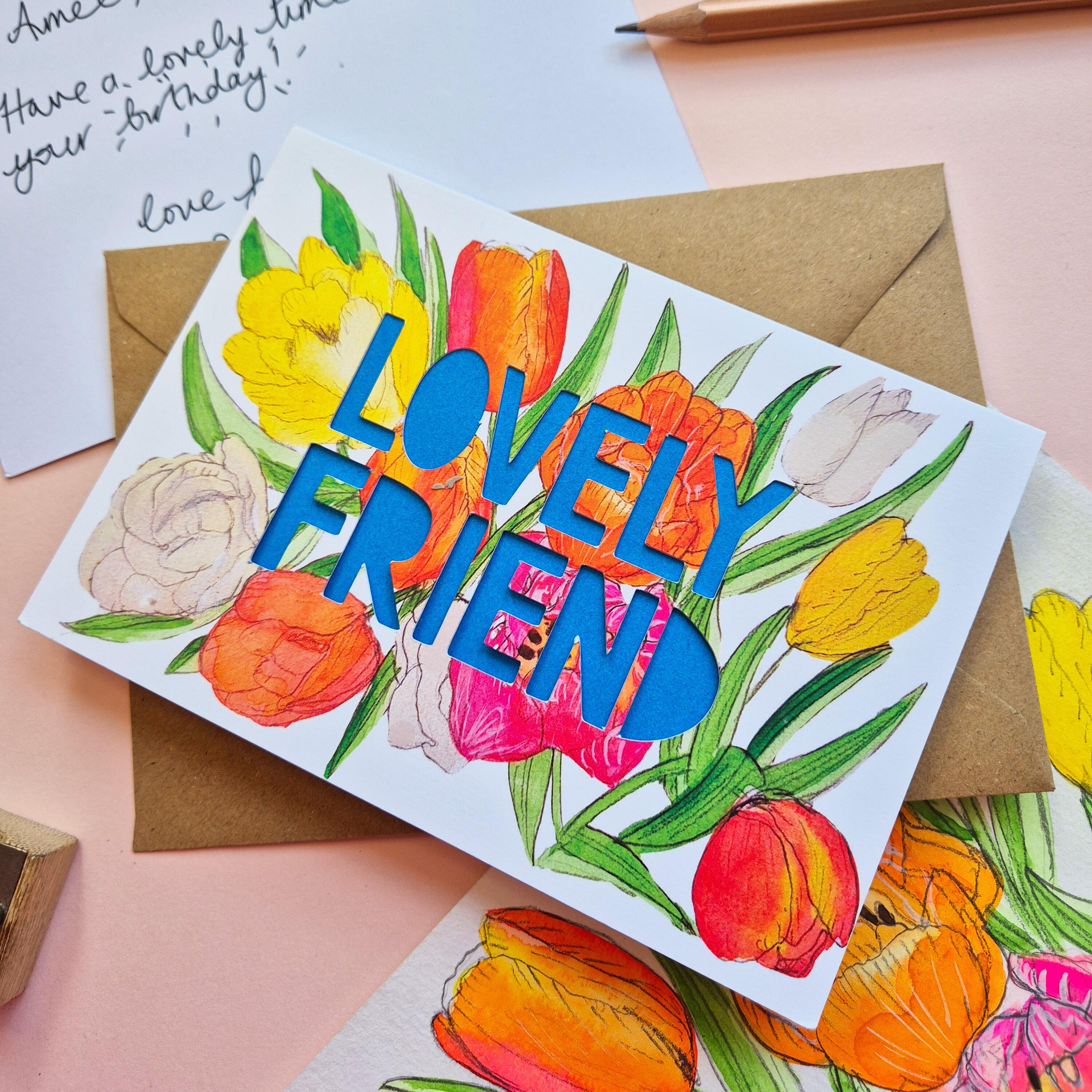 xTulip illustration card with Lovely Friend die cut text and bright blue paper liner