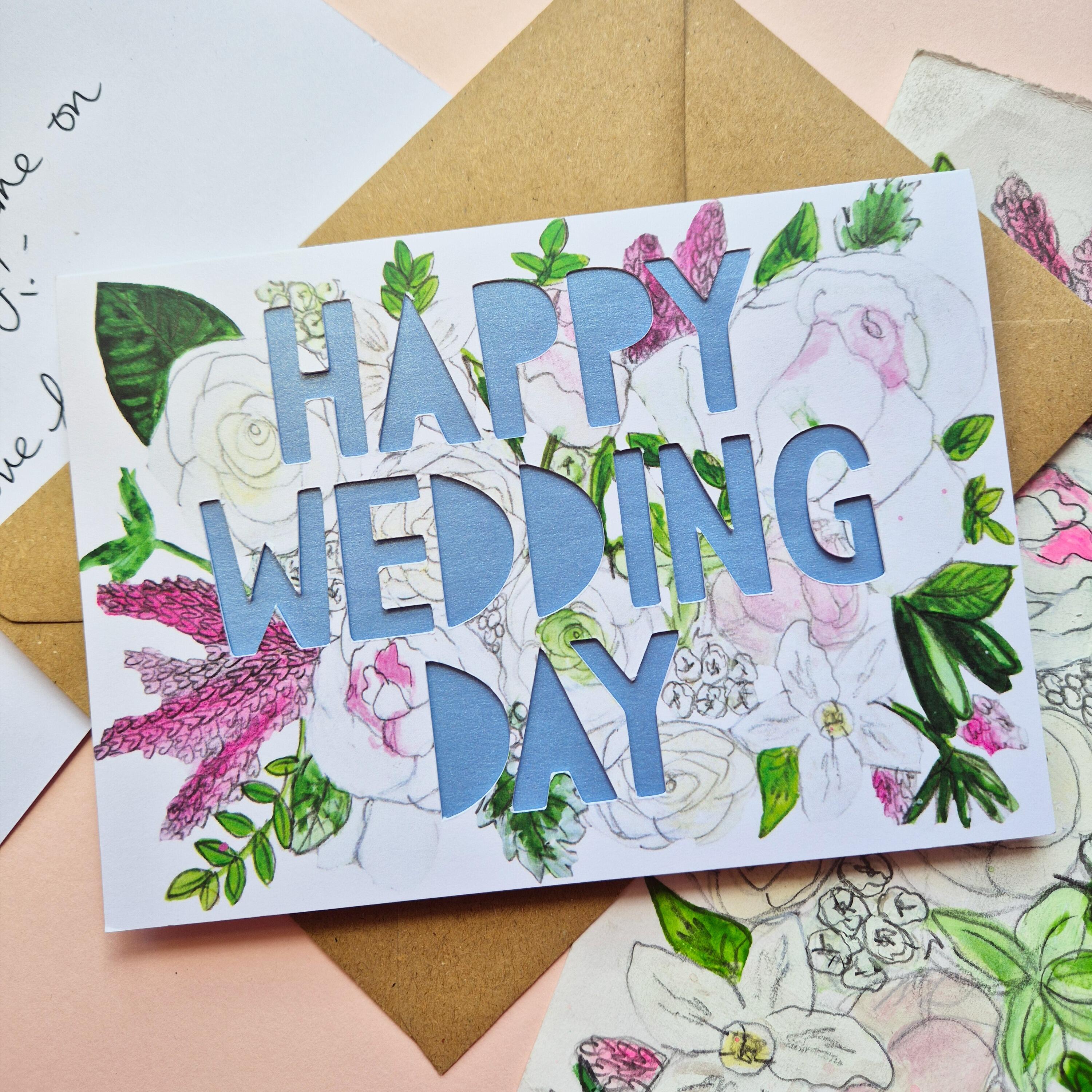 White and Pink floral illustration card with Happy Wedding Day paper cut text and shimmering blue paper liner