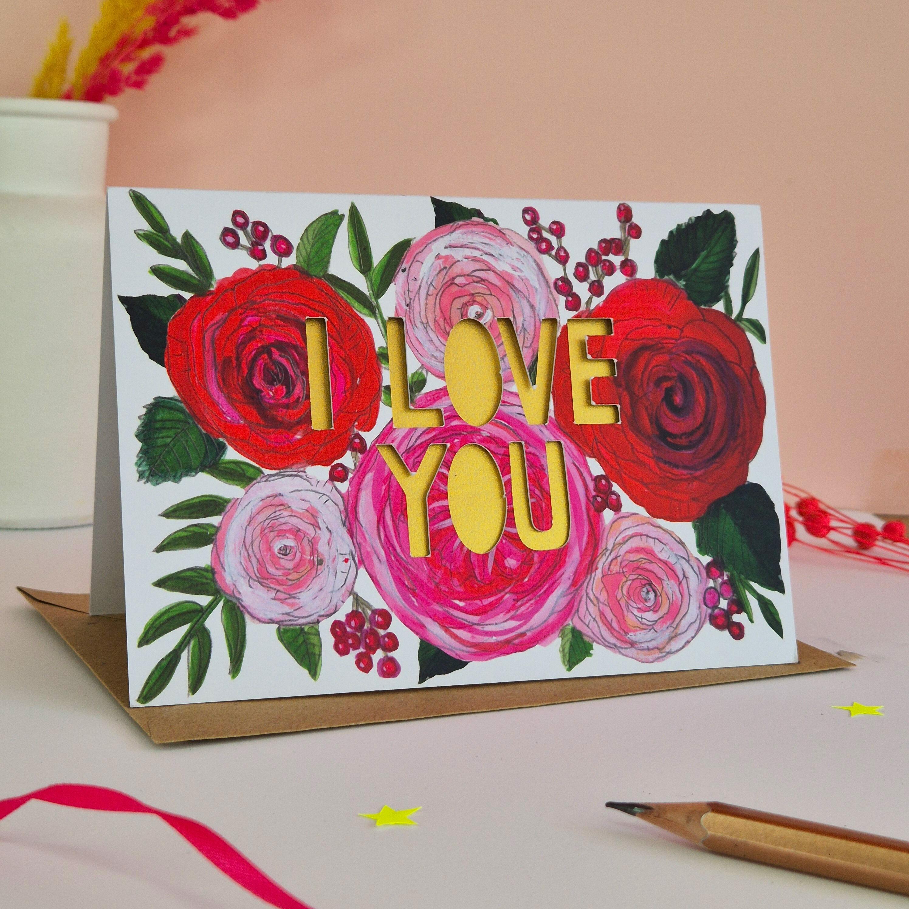 Red and pink floral illustration card with I Love you paper cut text and gold shimmering liner
