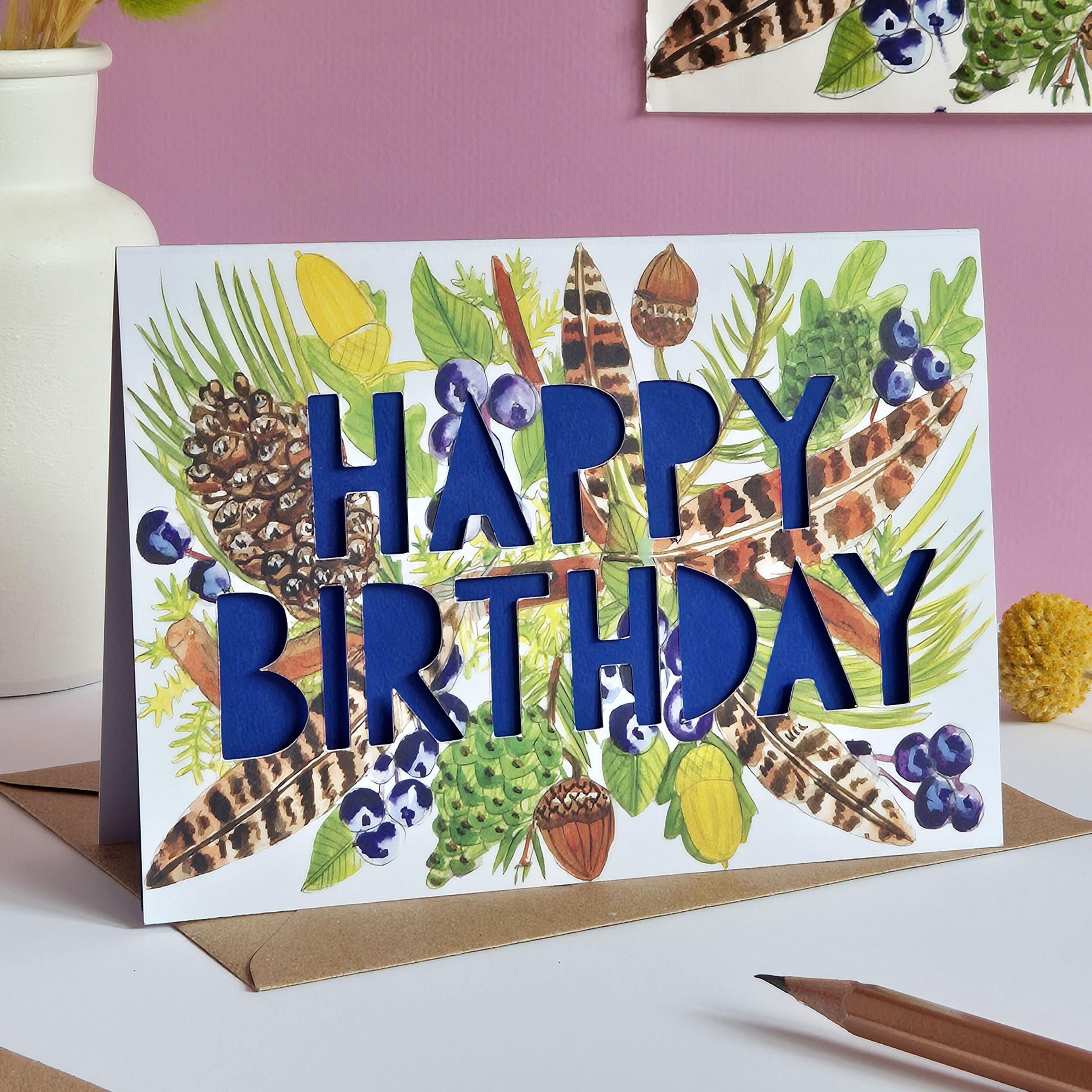 feather pinecone birthday card with dark blue cobalt paper cut text