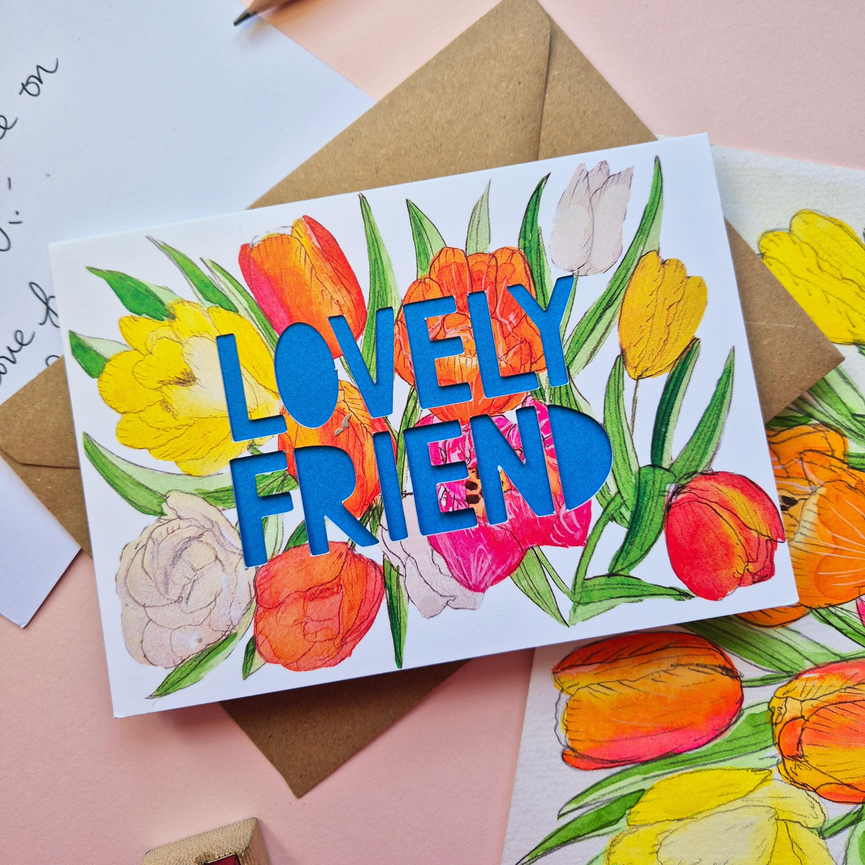Tulip illustration card with Lovely Friend die cut text and bright blue paper liner