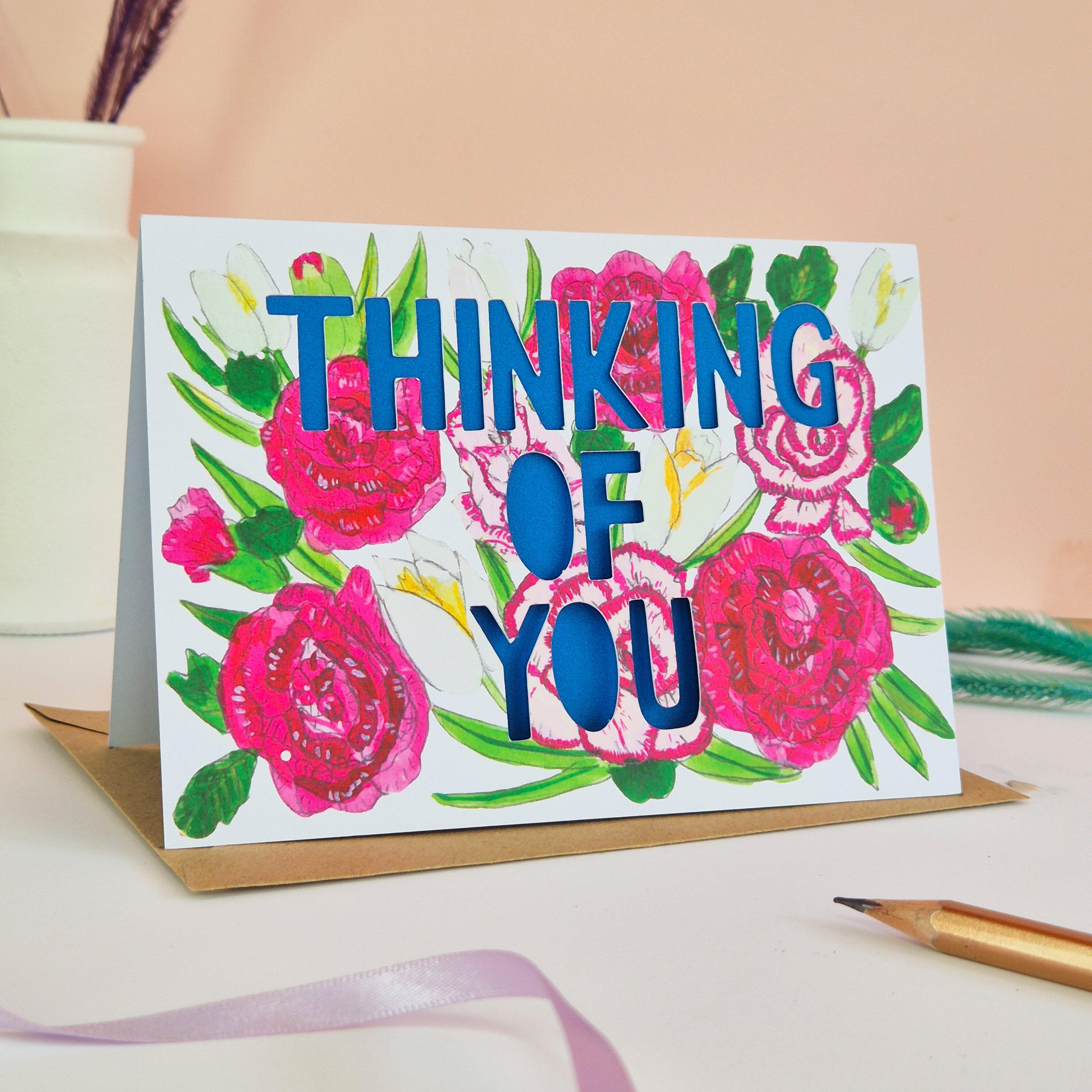 Carnation and rose illustration card with thinking of you die cut text and blue paper liner