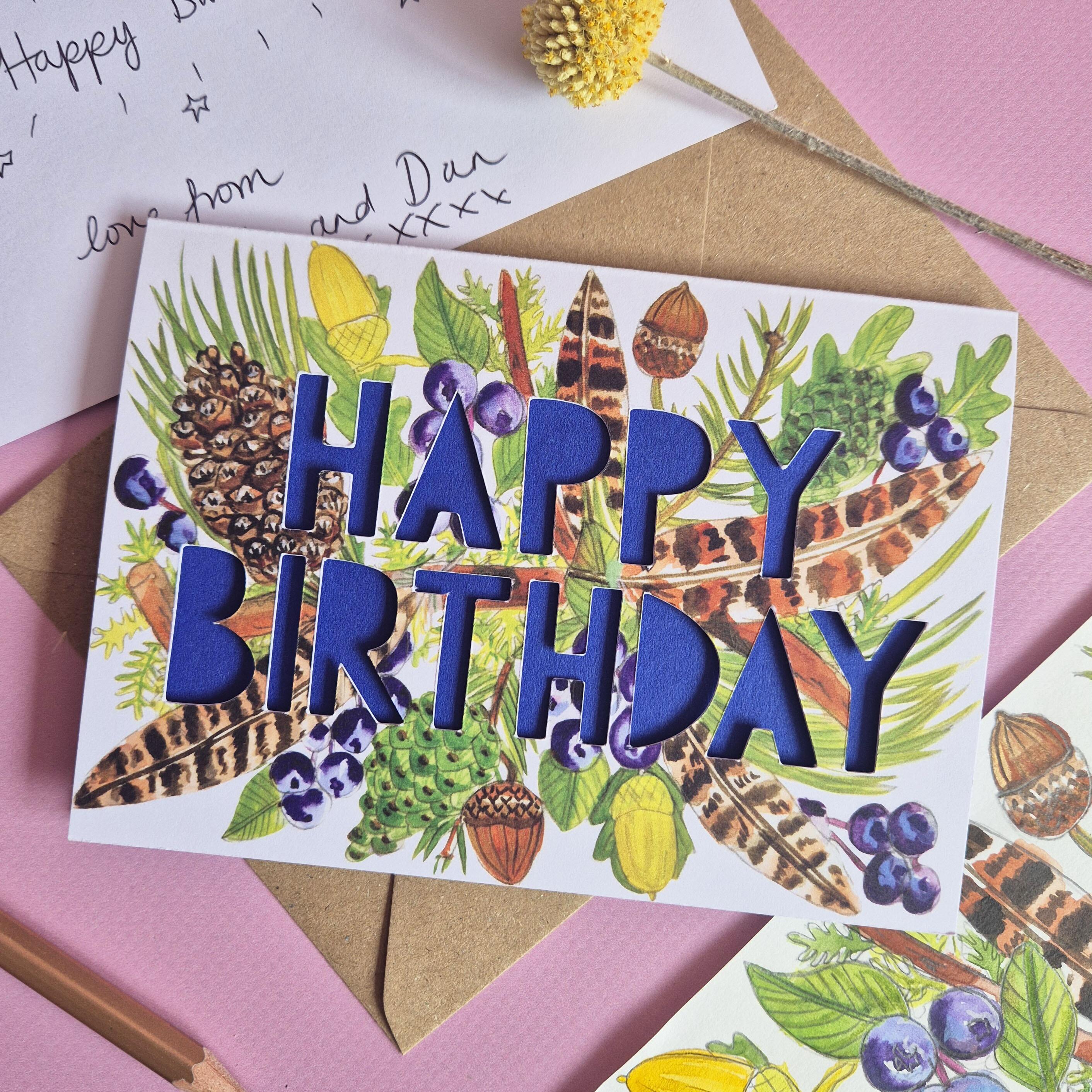 feather pinecone birthday card with dark blue cobalt paper cut text with handwritten message