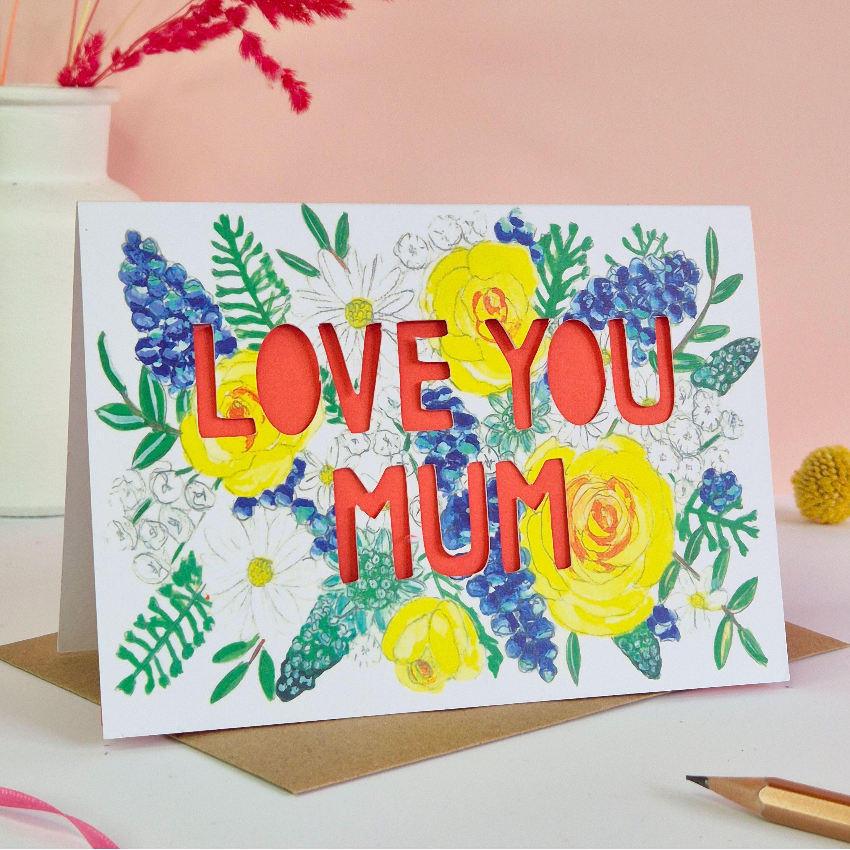 Card with 'Love you mum' in paper cut text with coral liner