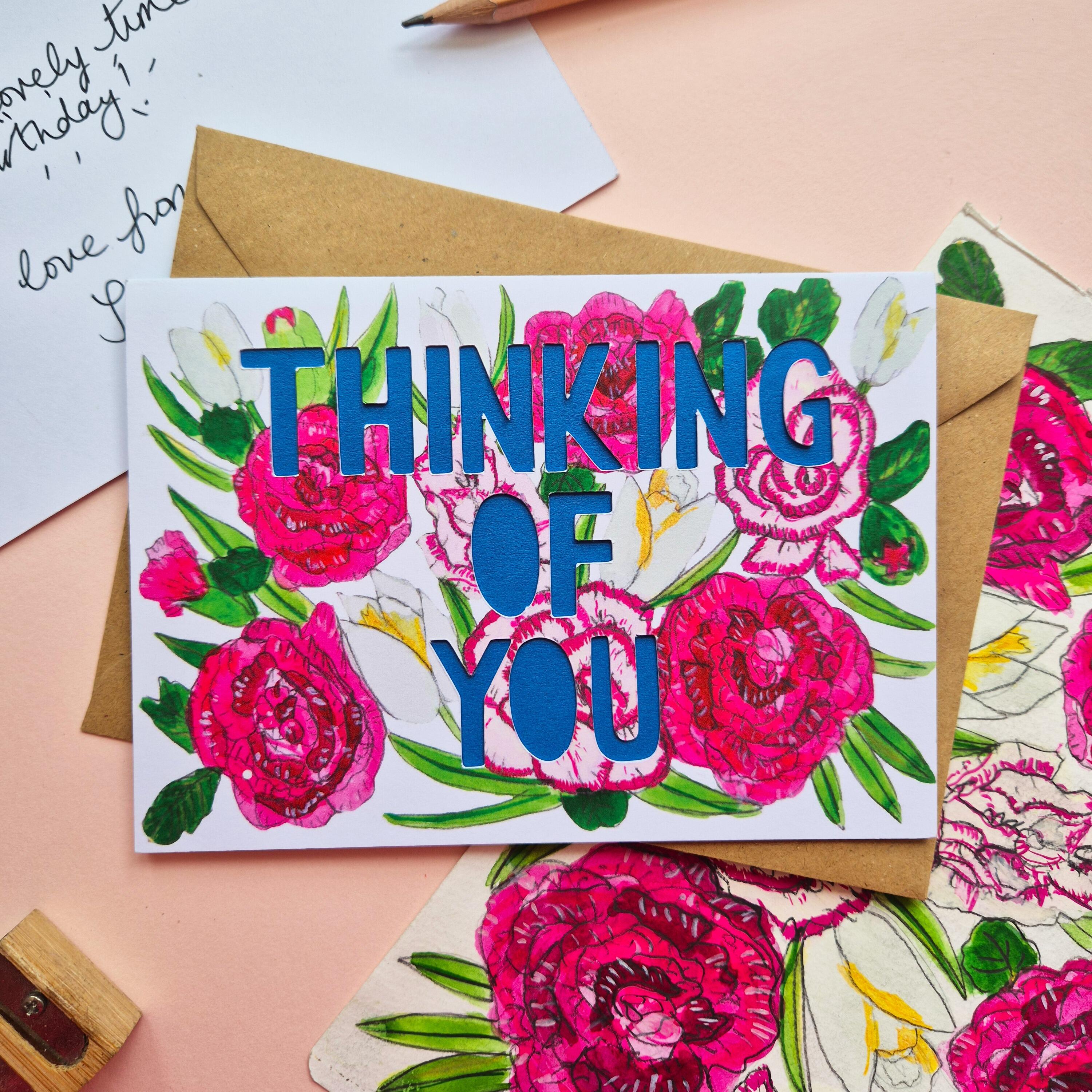 Carnation and rose illustration card with thinking of you die cut text and blue paper liner
