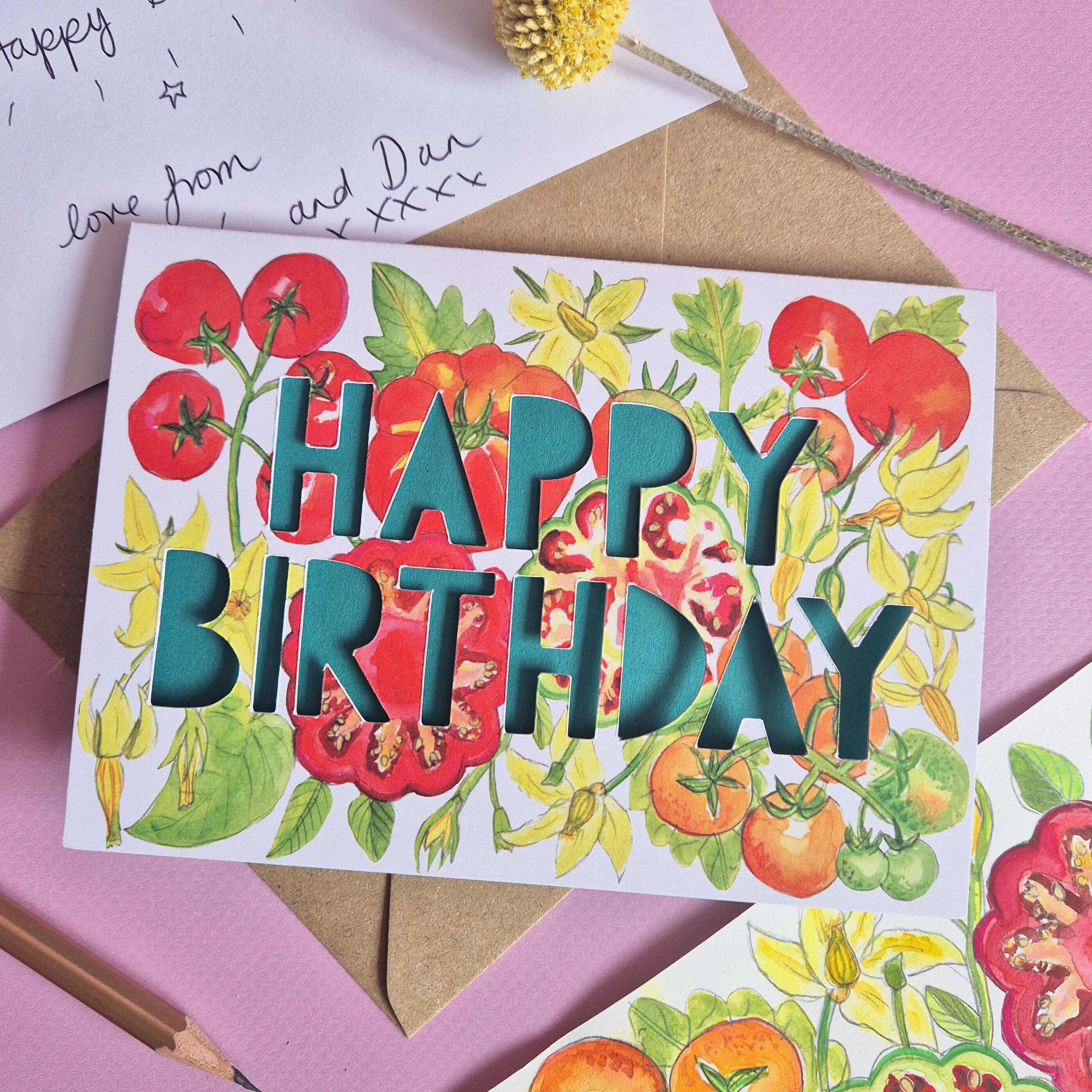 Birthday card with tomato print and paper cut text that says Happy Birthday in green with handwriting example