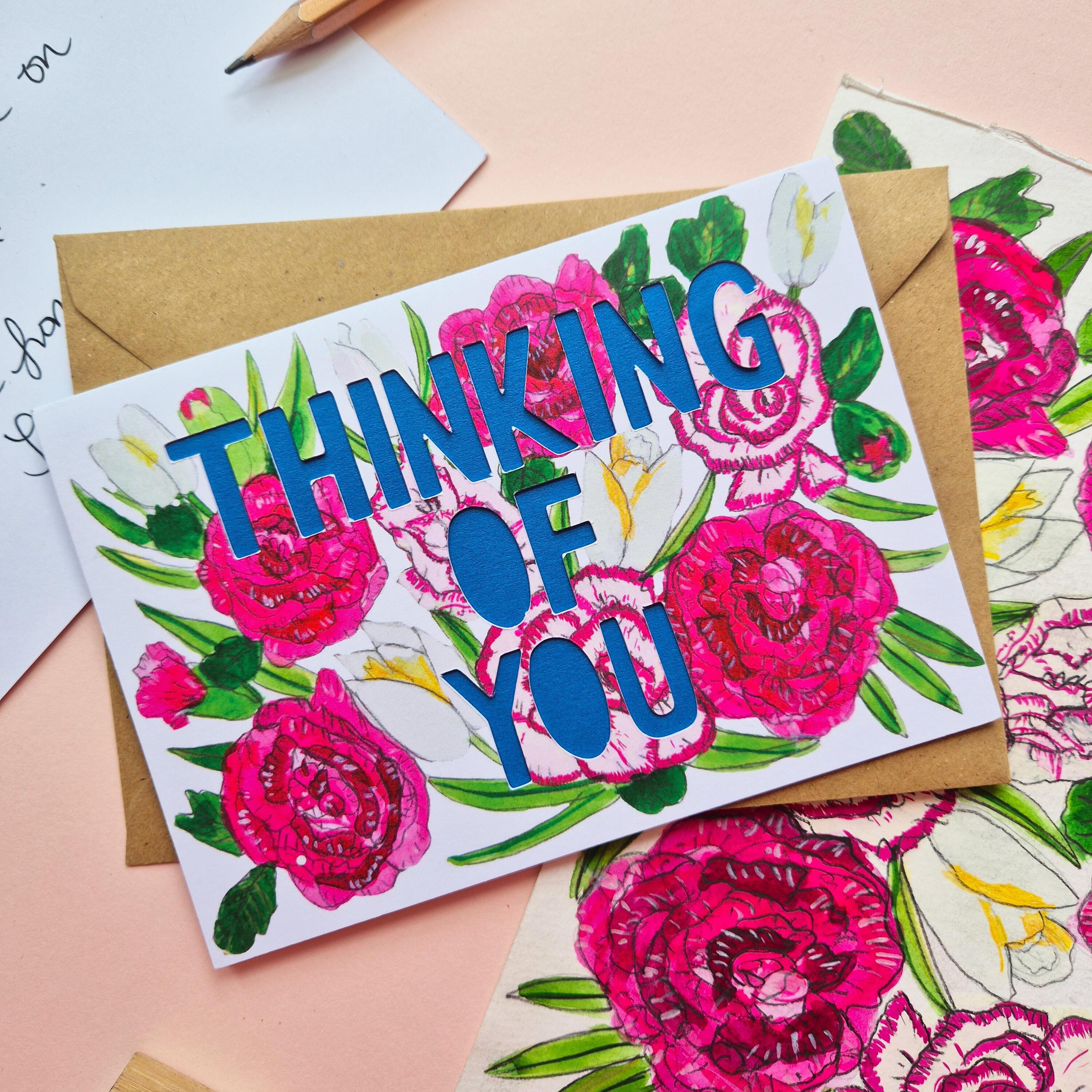 Carnation and rose illustration card with thinking of you die cut text and blue paper liner