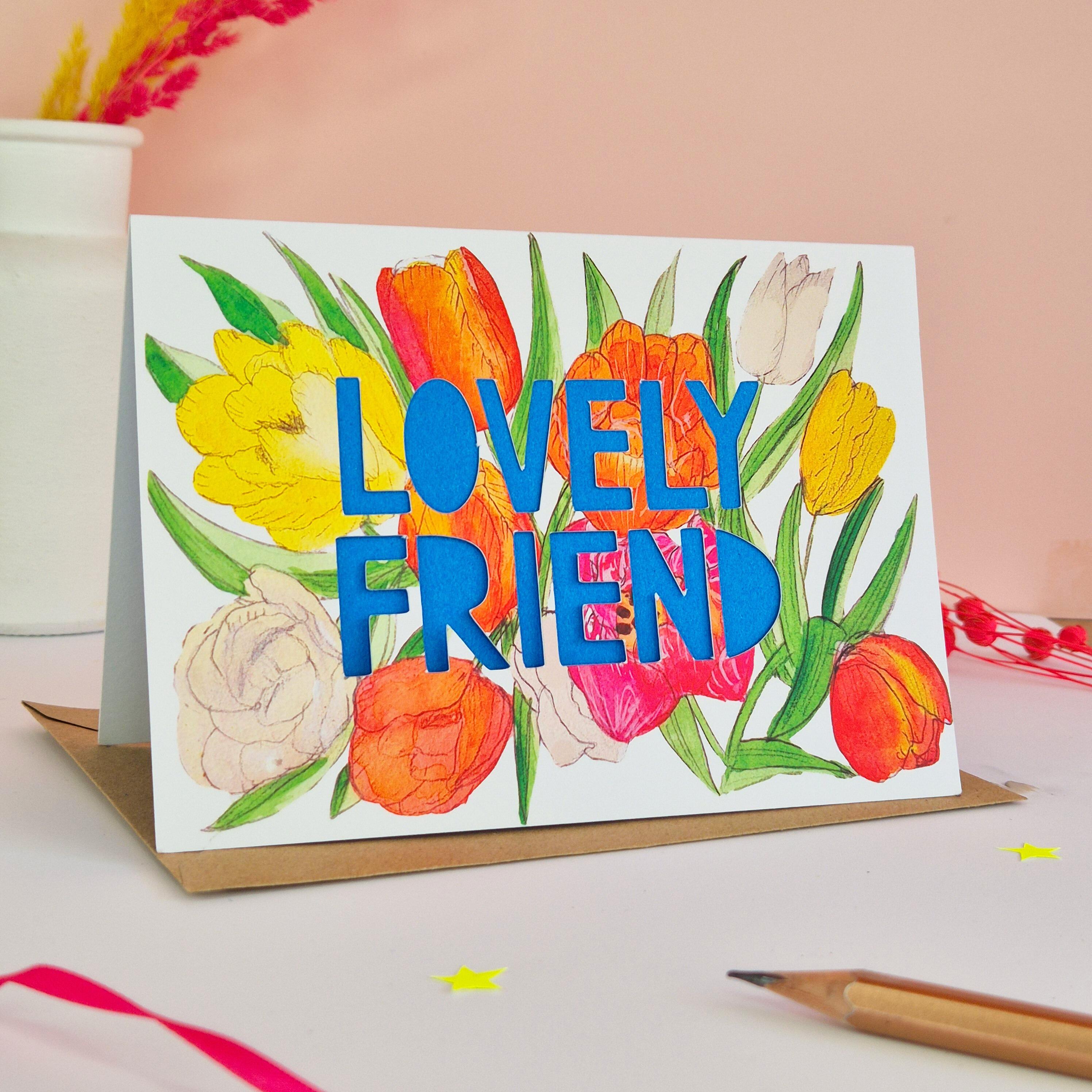 Tulip illustration card with Lovely Friend die cut text and bright blue paper liner