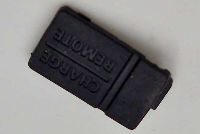 "Uniden COVER 0054 – rubber USB slot cover for UBC125XLT scanner, protects port from dust and damage"