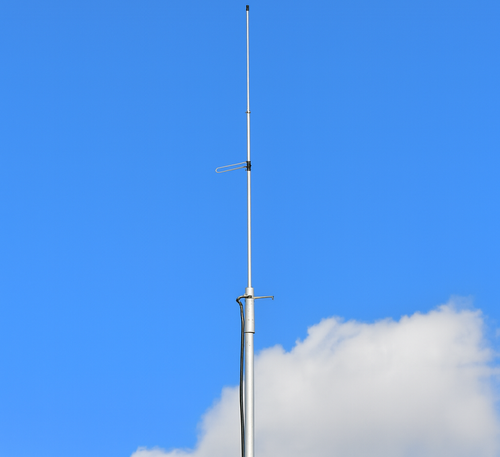 Cushcraft AR-X2 2m vertical antenna mounted on mast against blue sky