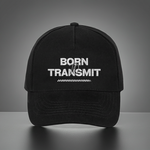 Front view of black cap with bold white stitching – Born to Transmit logo