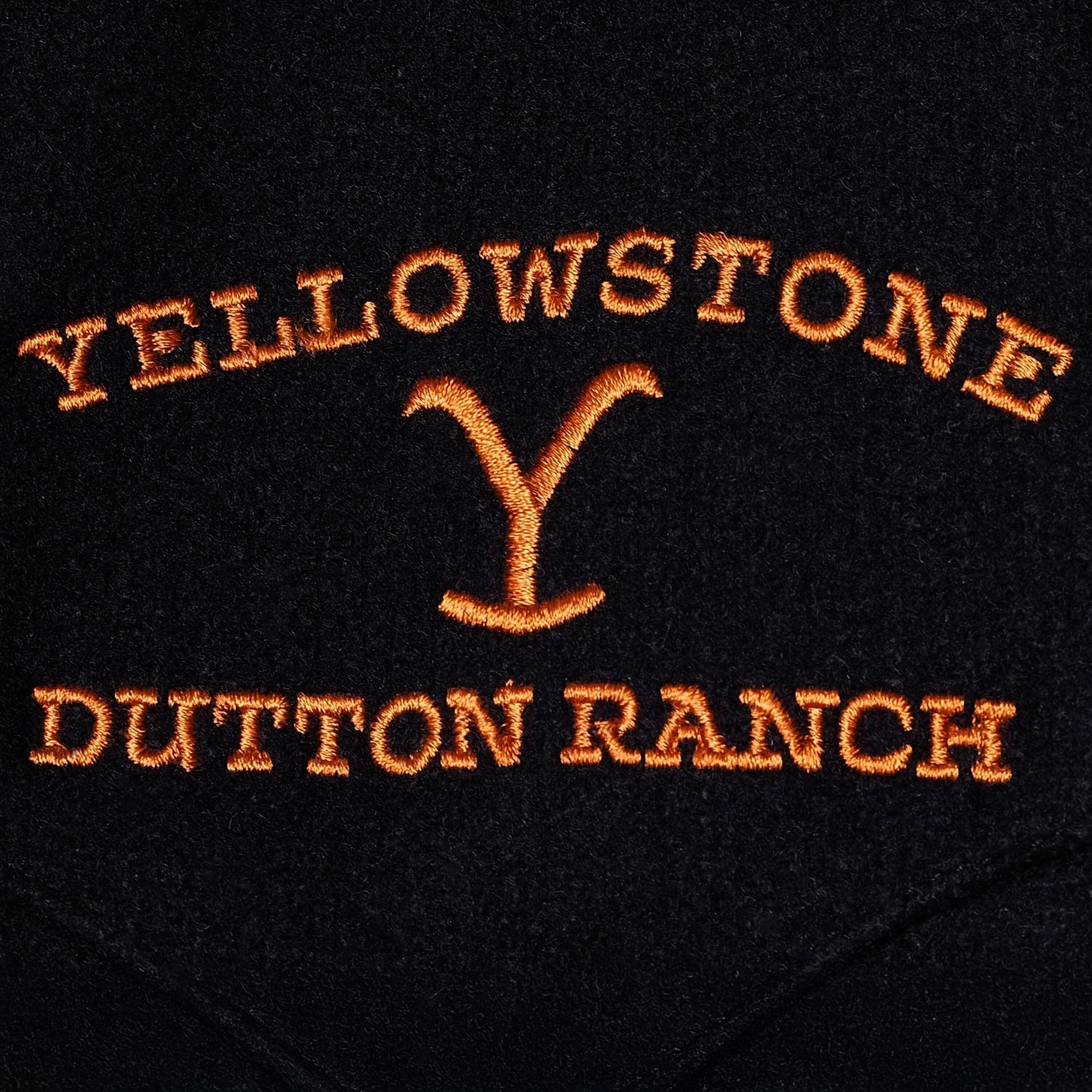 Close-Up of the Yellowstone Dutton Ranch logo from a black wool vest by Schaefer and worn by Kevin Costner in Yellowstone