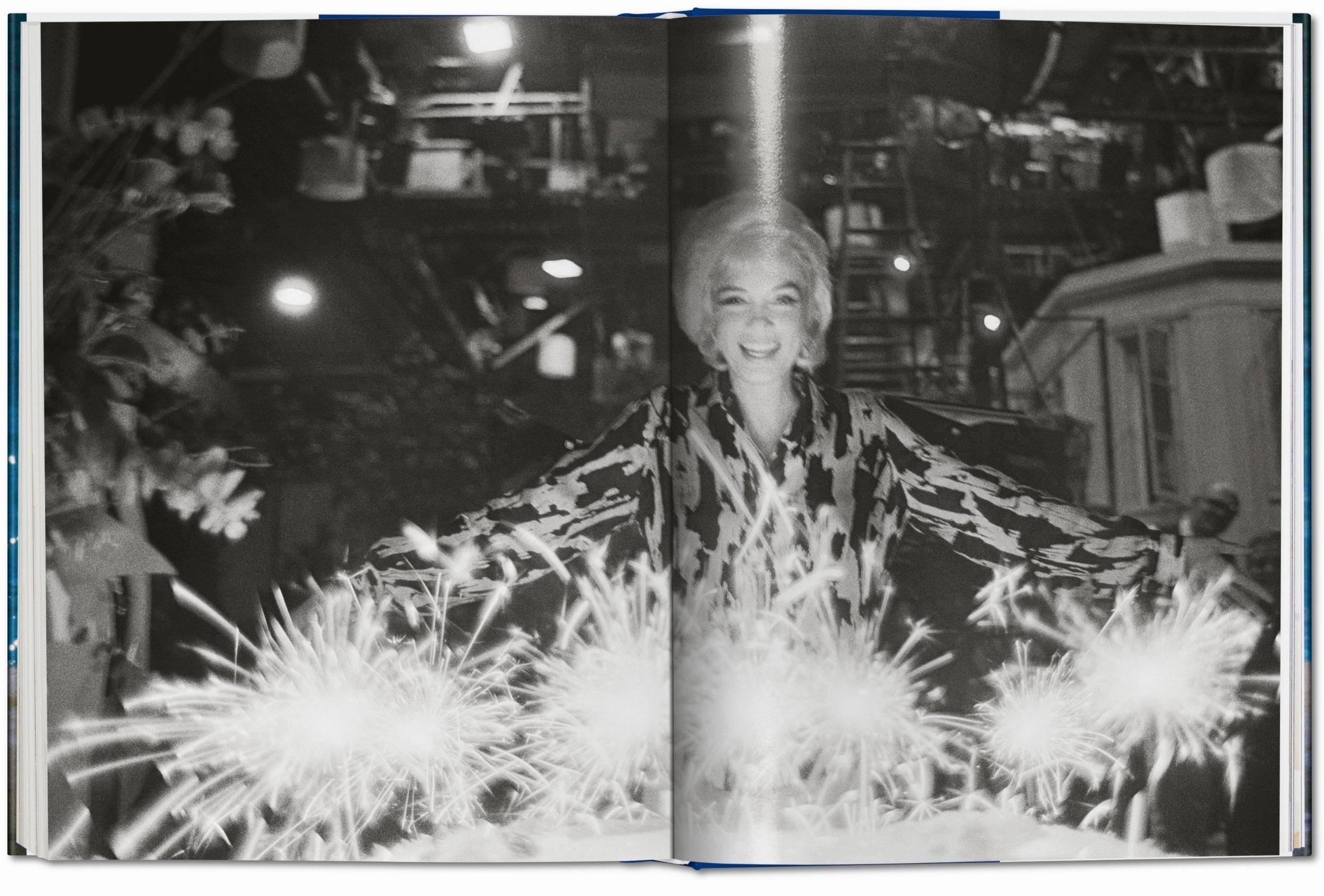 Lawrence Schiller. Marilyn & Me, black and white photo of Marilyn with sparklers