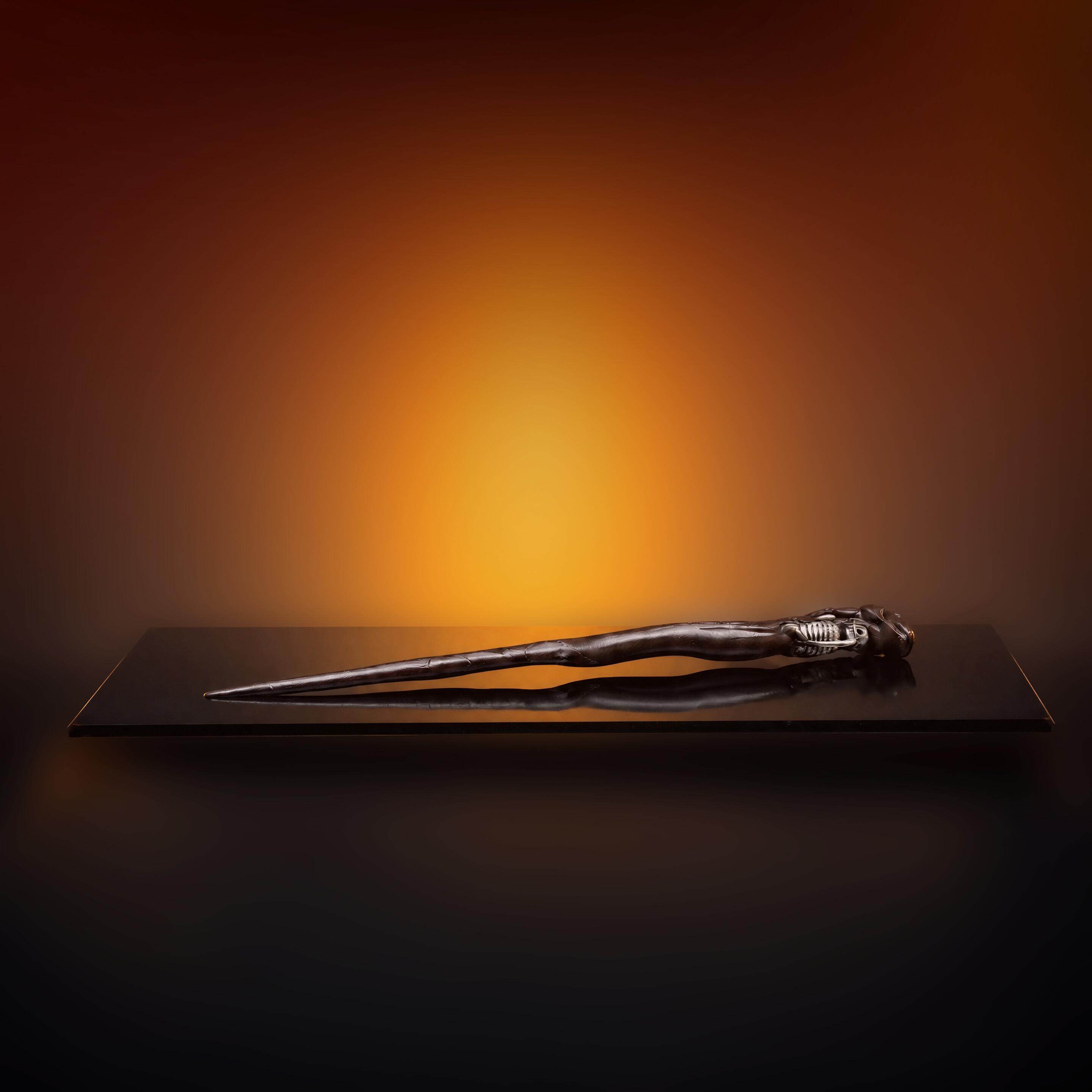 On Black perspex - An original production-made Death Eater Skull Wand created for Harry Potter and the Deathly Hallows: Part 1 (2010) and Part 2 (2011).