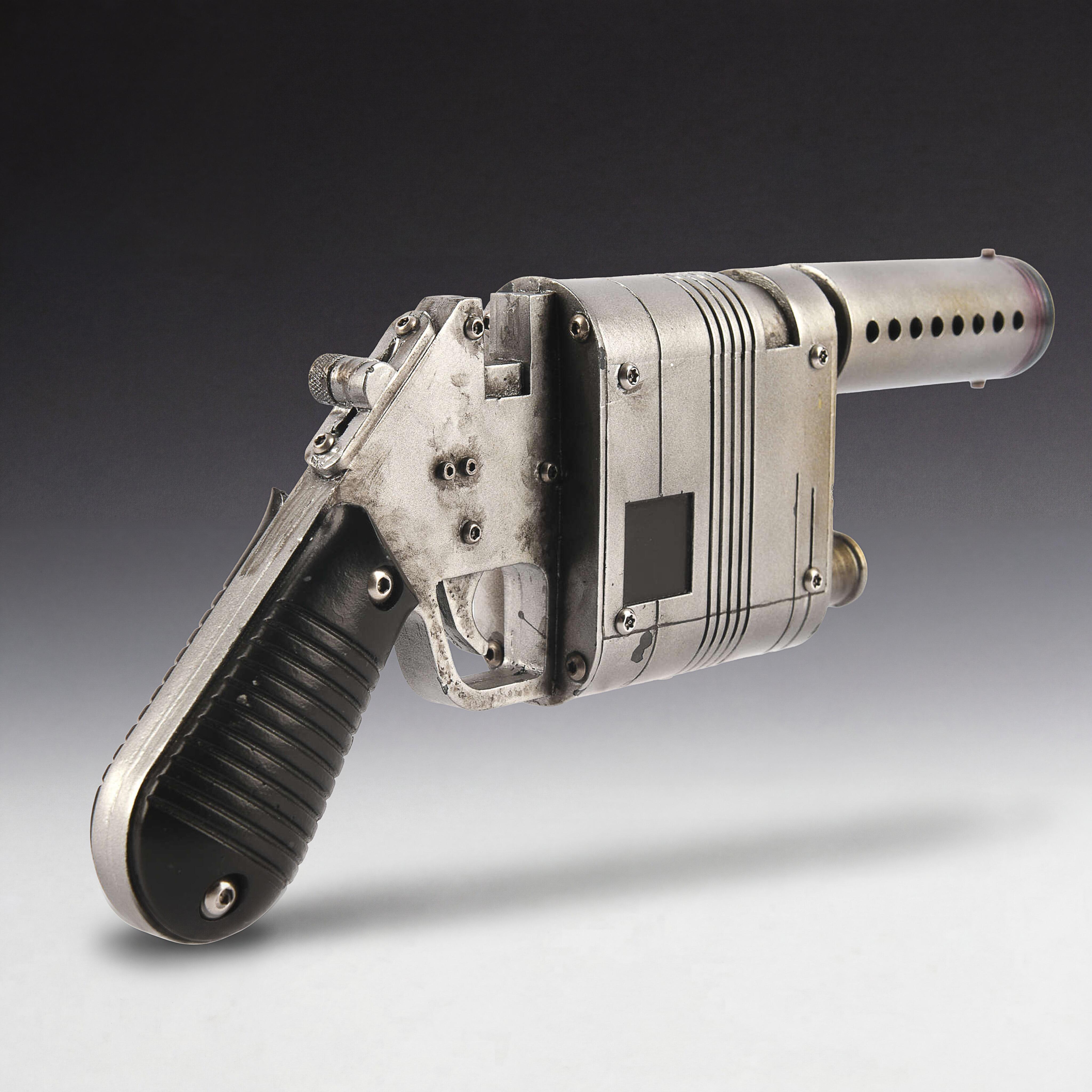 Cast resin NN-14 blaster prop for Rey in The Force Awakens, featuring hand-painted metallic finish and iridescent heat-tinted barrel.