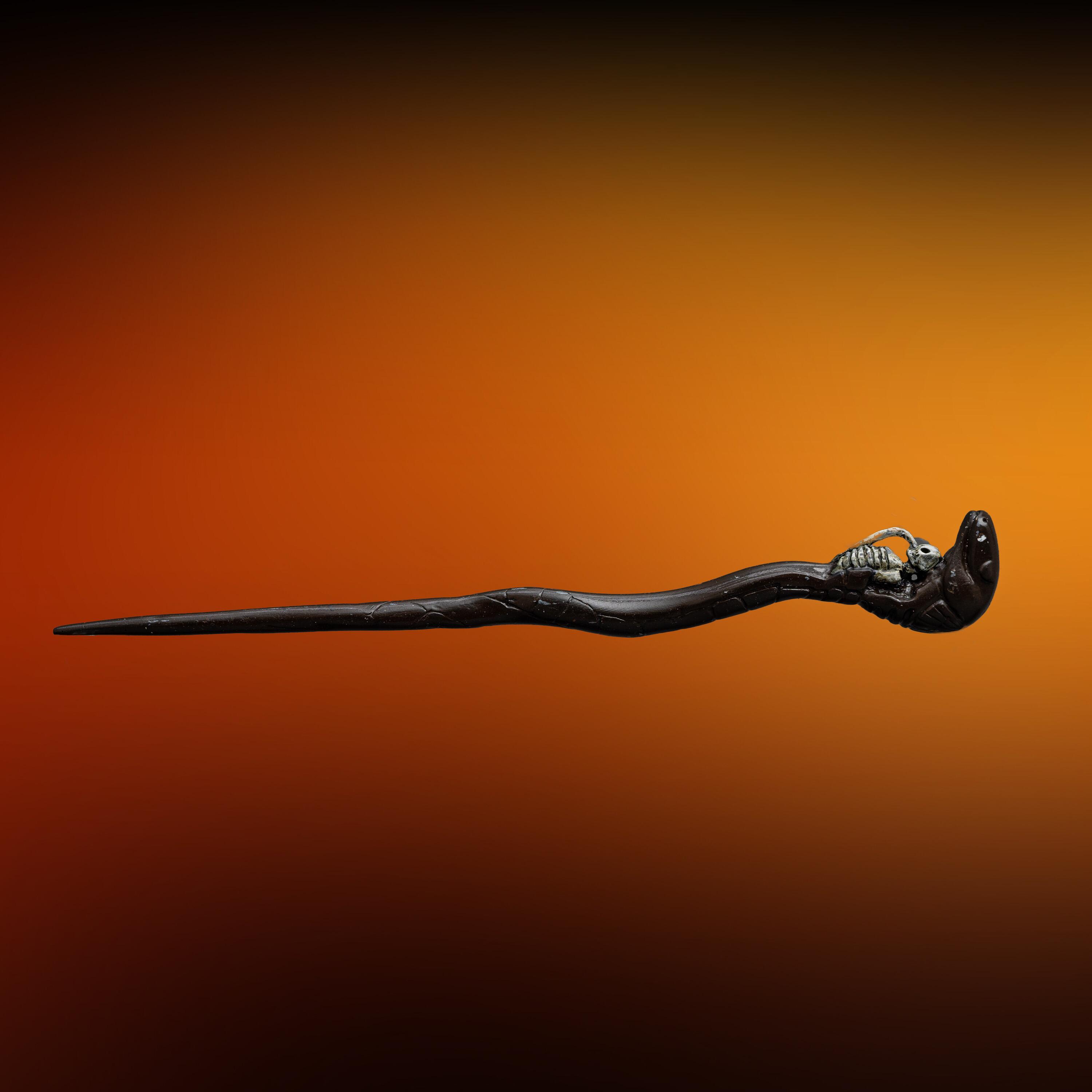 Full length horizontal view -An original production-made Death Eater Skull Wand created for Harry Potter and the Deathly Hallows: Part 1 (2010) and Part 2 (2011).