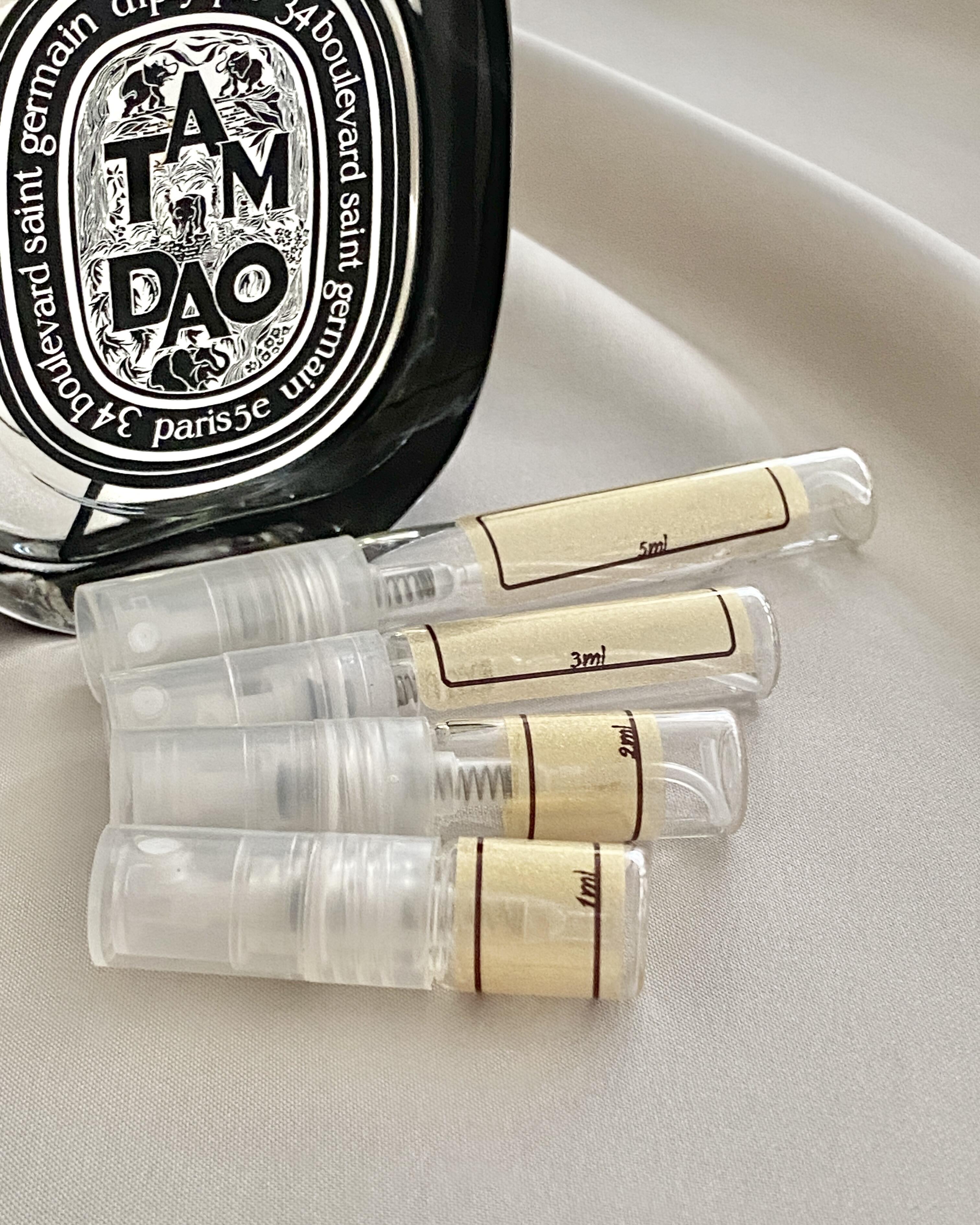Diptyque Tam Dao and sample bottles
