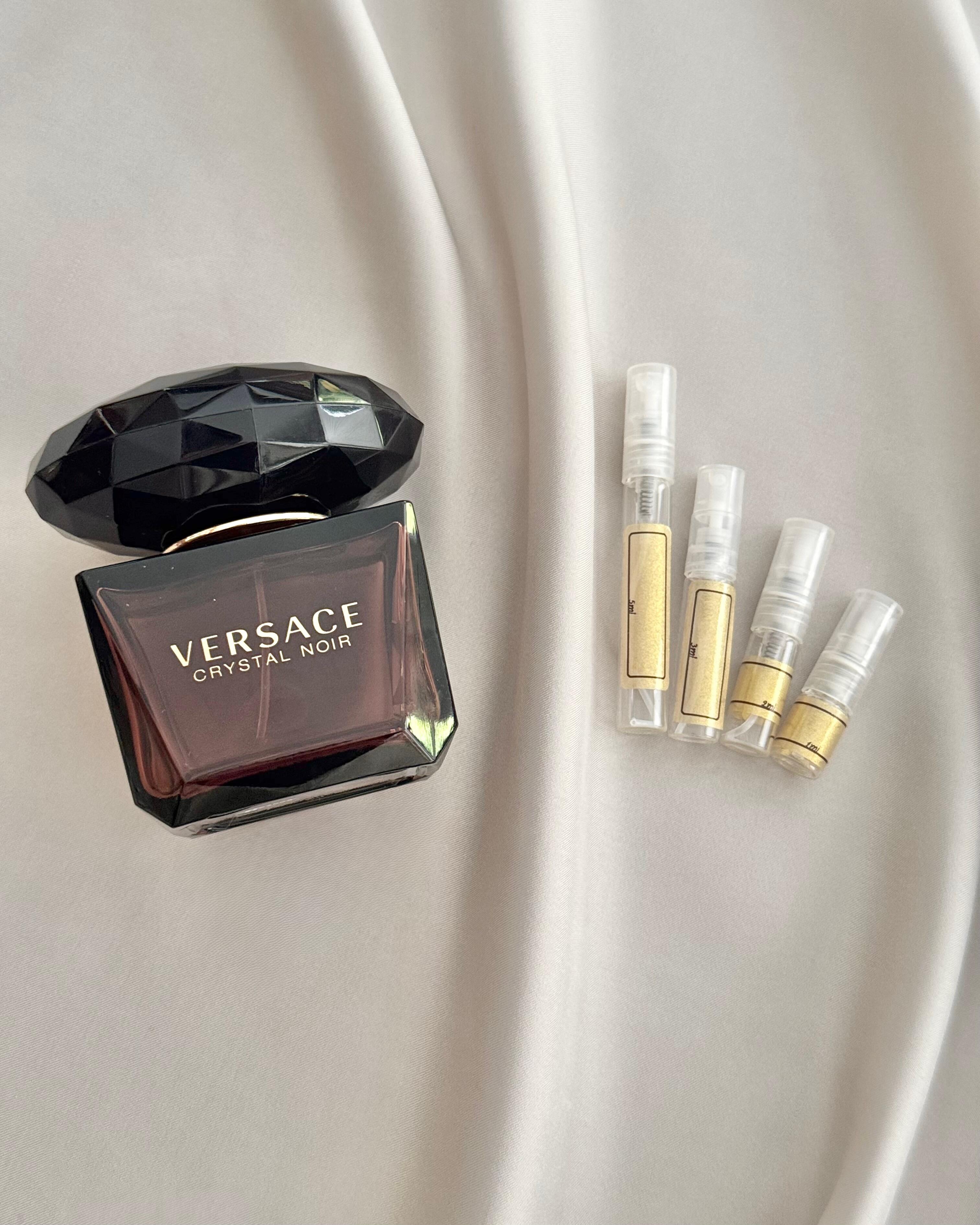 Versace Crystal Noir Parfum with sample bottles