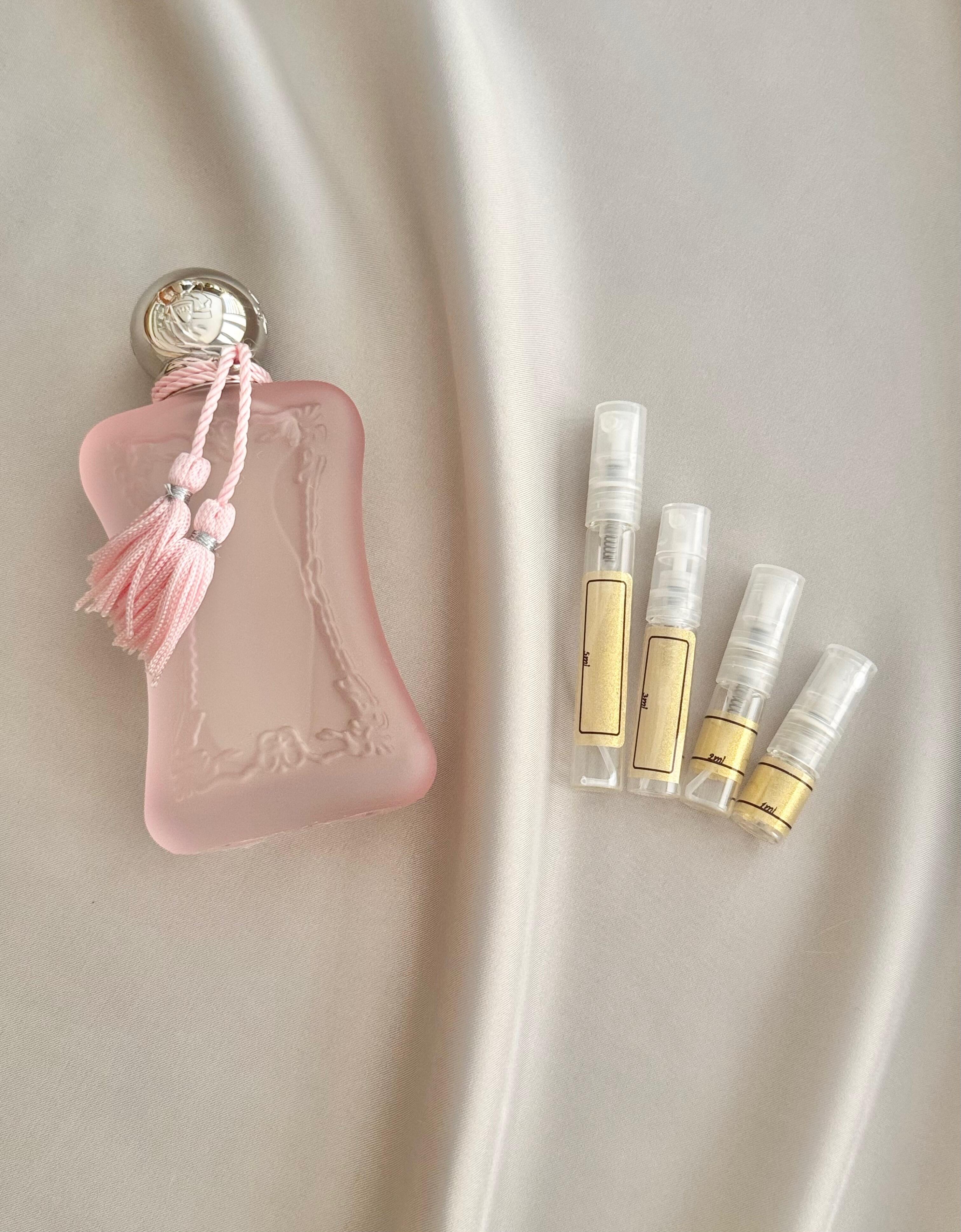 Delina La Rosee with samples bottles