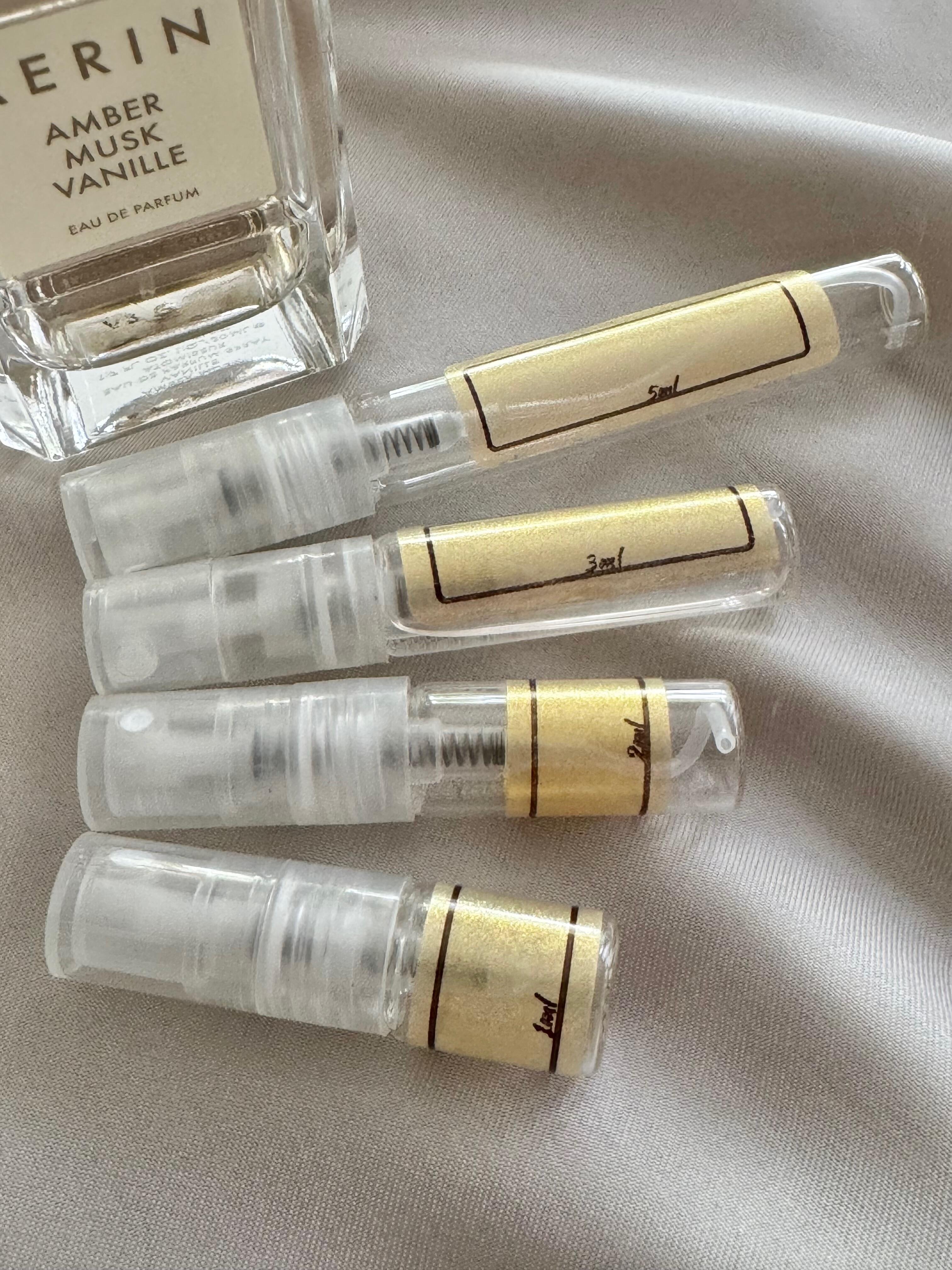 AERIN Amber Musk Vanille and sample bottles