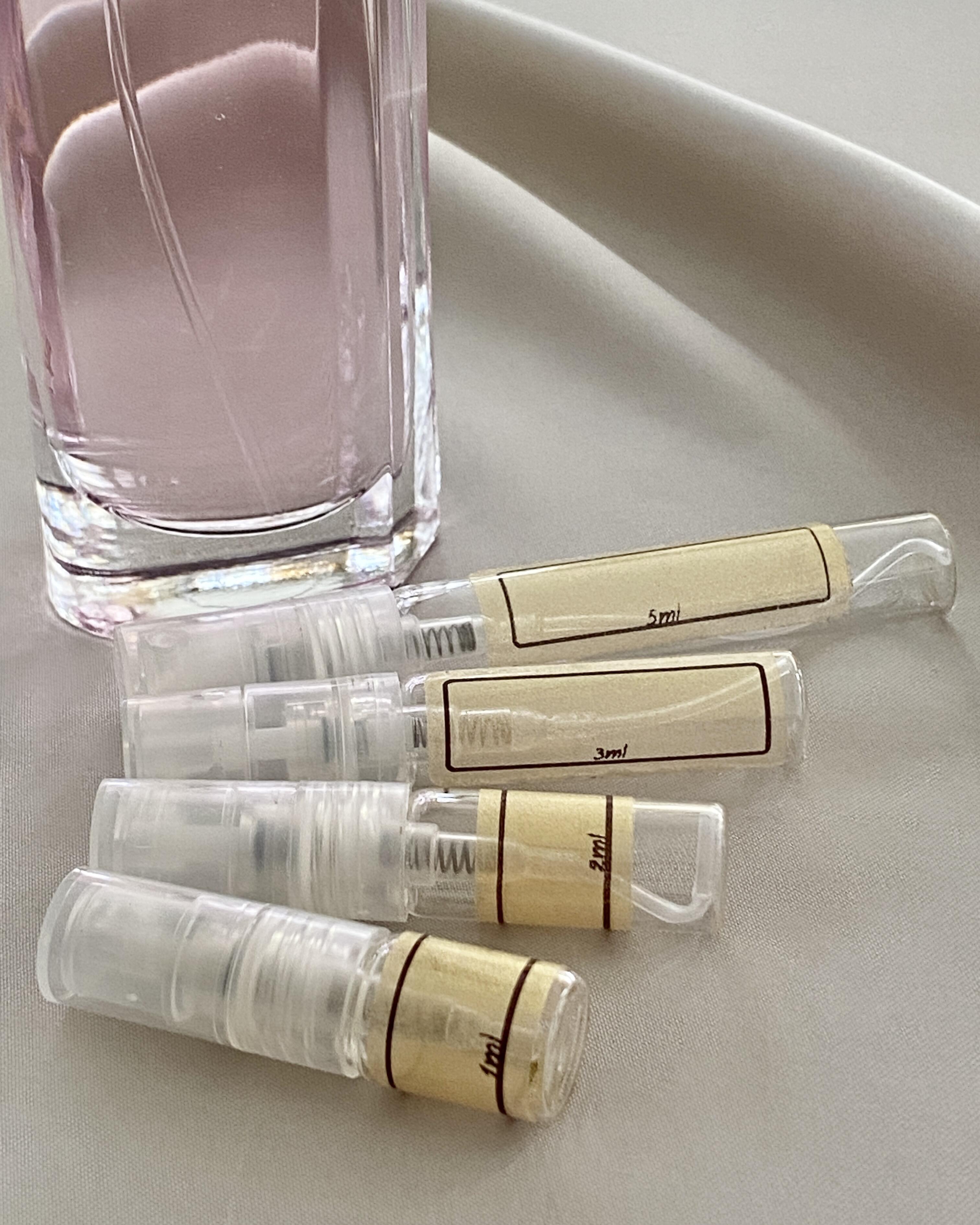 Mugler Womanity and sample bottles