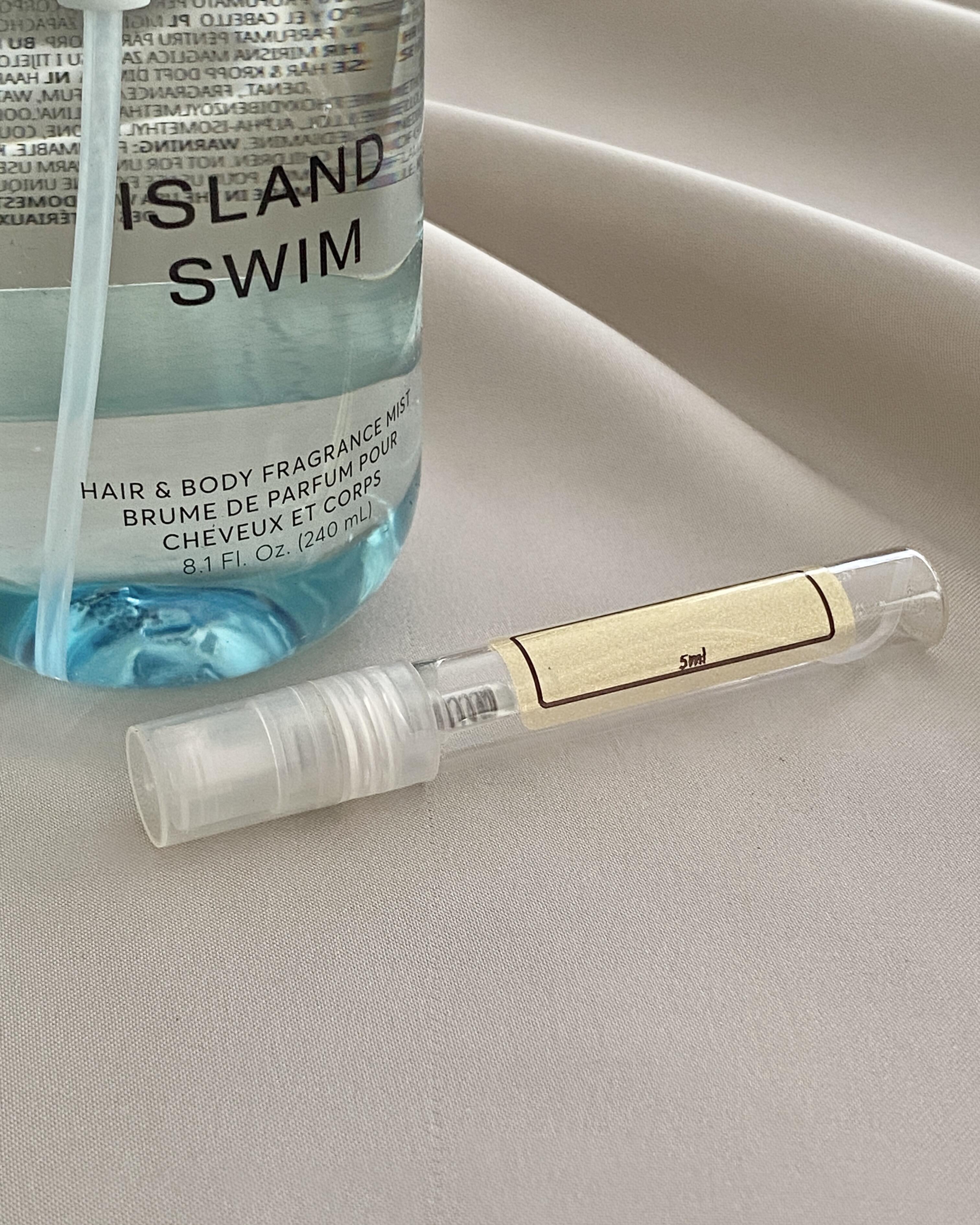 Phlur Island Swim with sample bottle