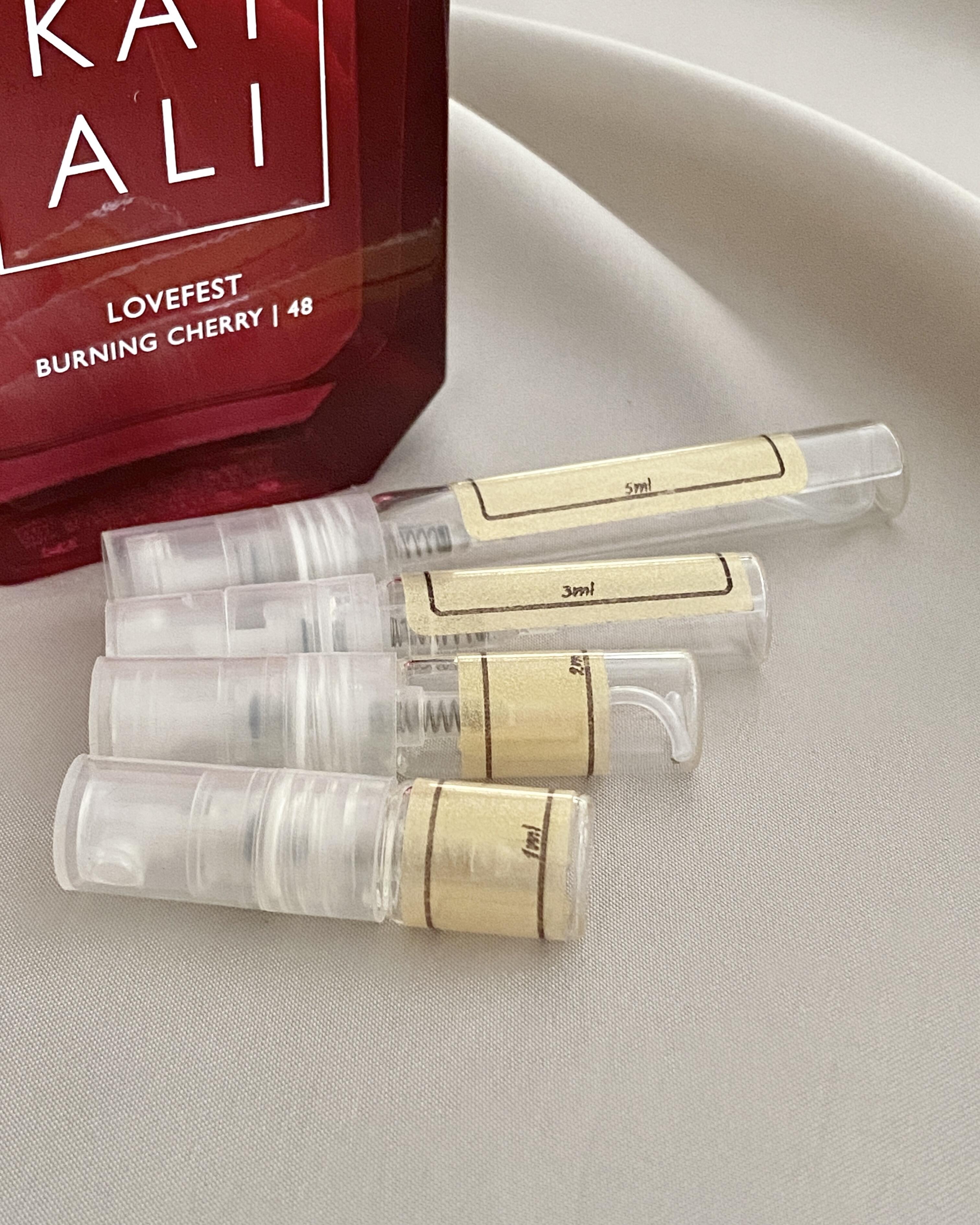 Kayali Lovefest Burning Cherry and sample bottles