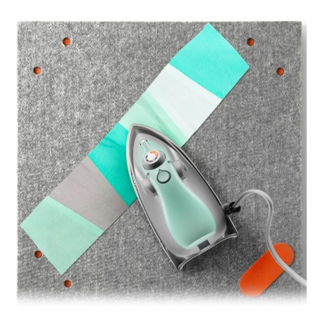 Oliso Mini Iron Aqua in use