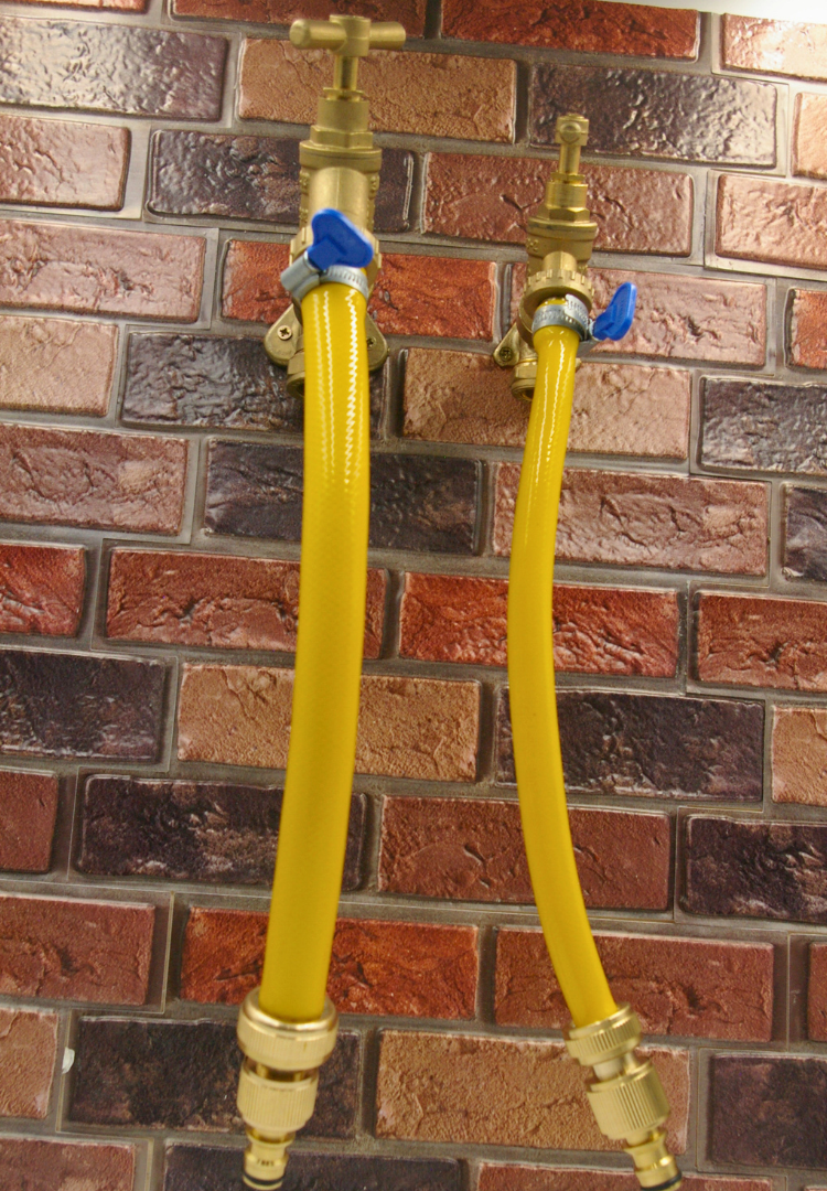 Photo of a 3/4BSP and 7/8BSP outlet with a hose set attached