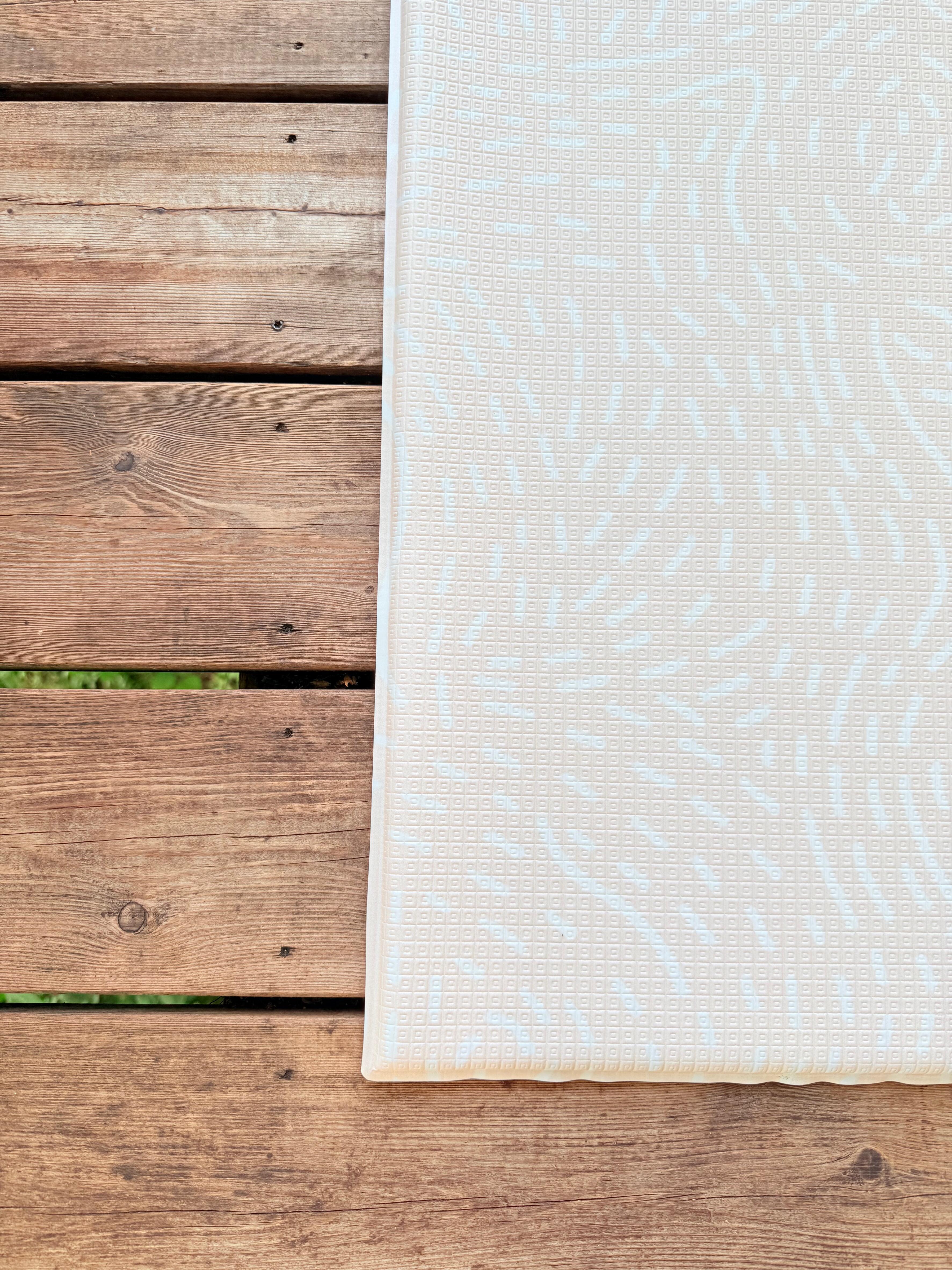 Close-up of Apricot Blush textured surface β wipe-clean non-toxic baby play mat for modern neutral nurseries