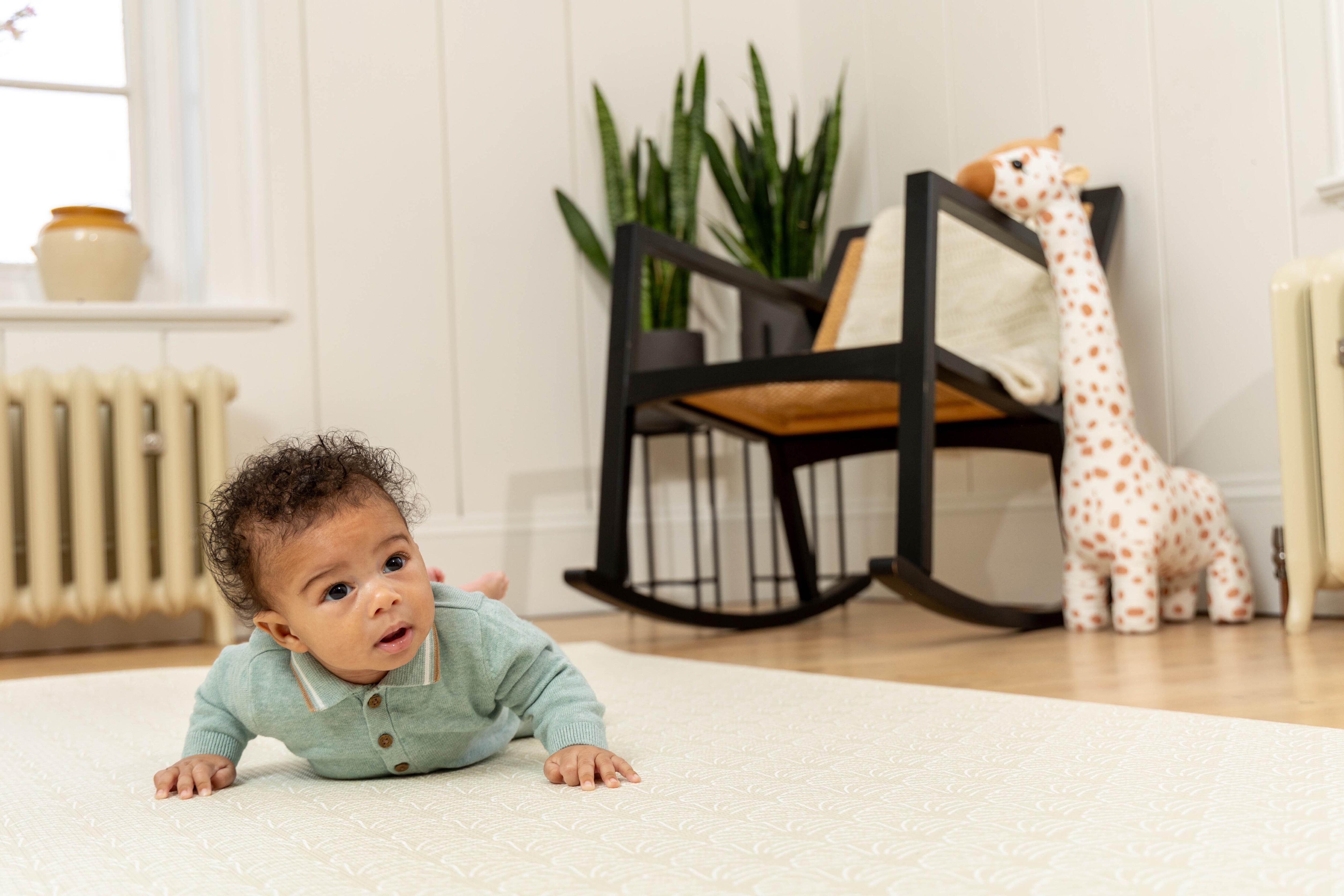 Medium Neptune Playmat in Sage rolled neatly for simple storage