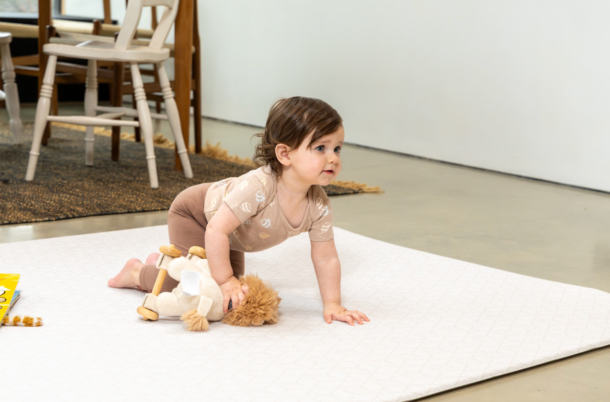 Neutral reversible playmat side used for everyday family play