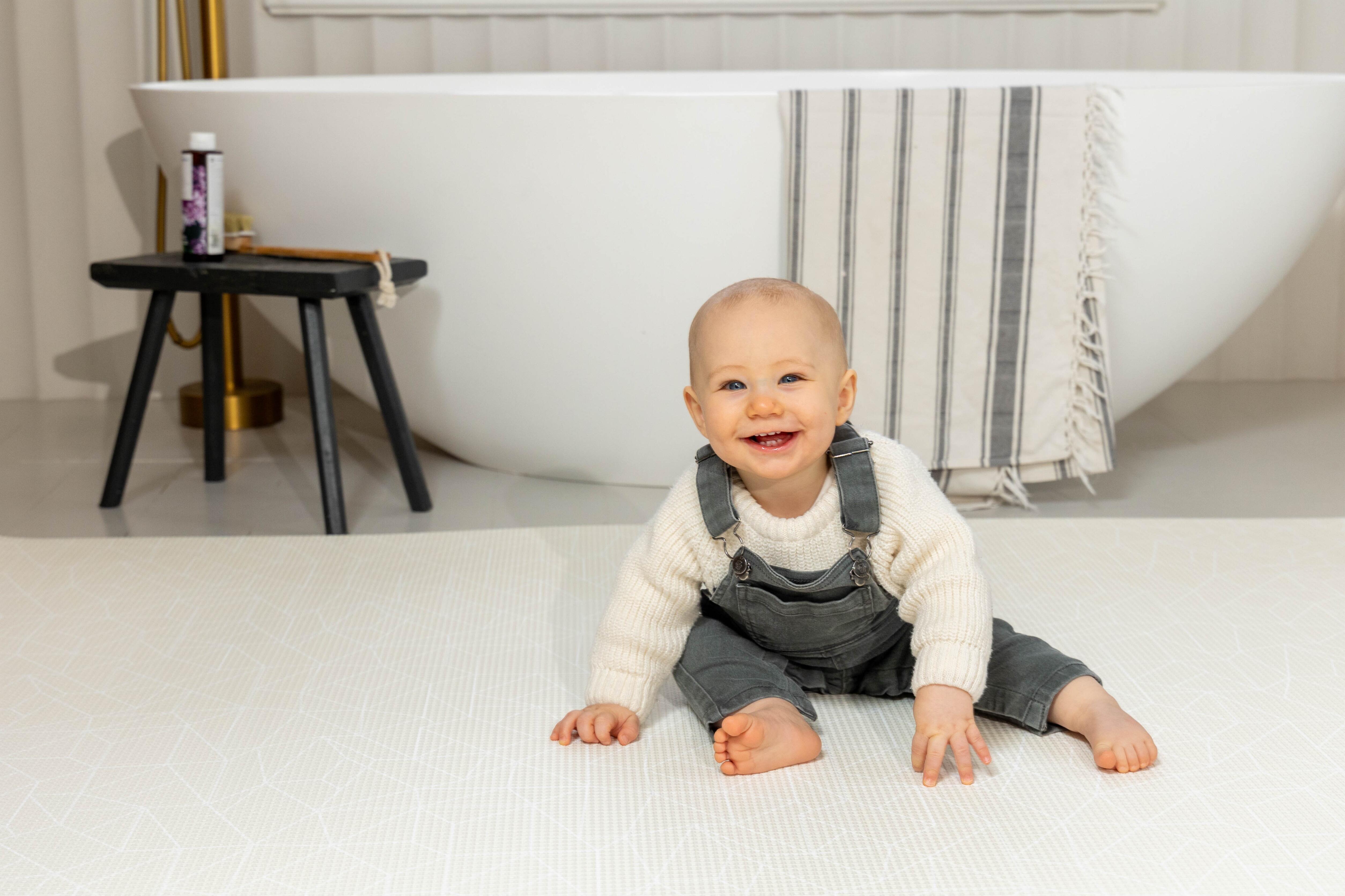 Medium Nordic Explorer Playmat in Cornish Cream rolled neatly for storage