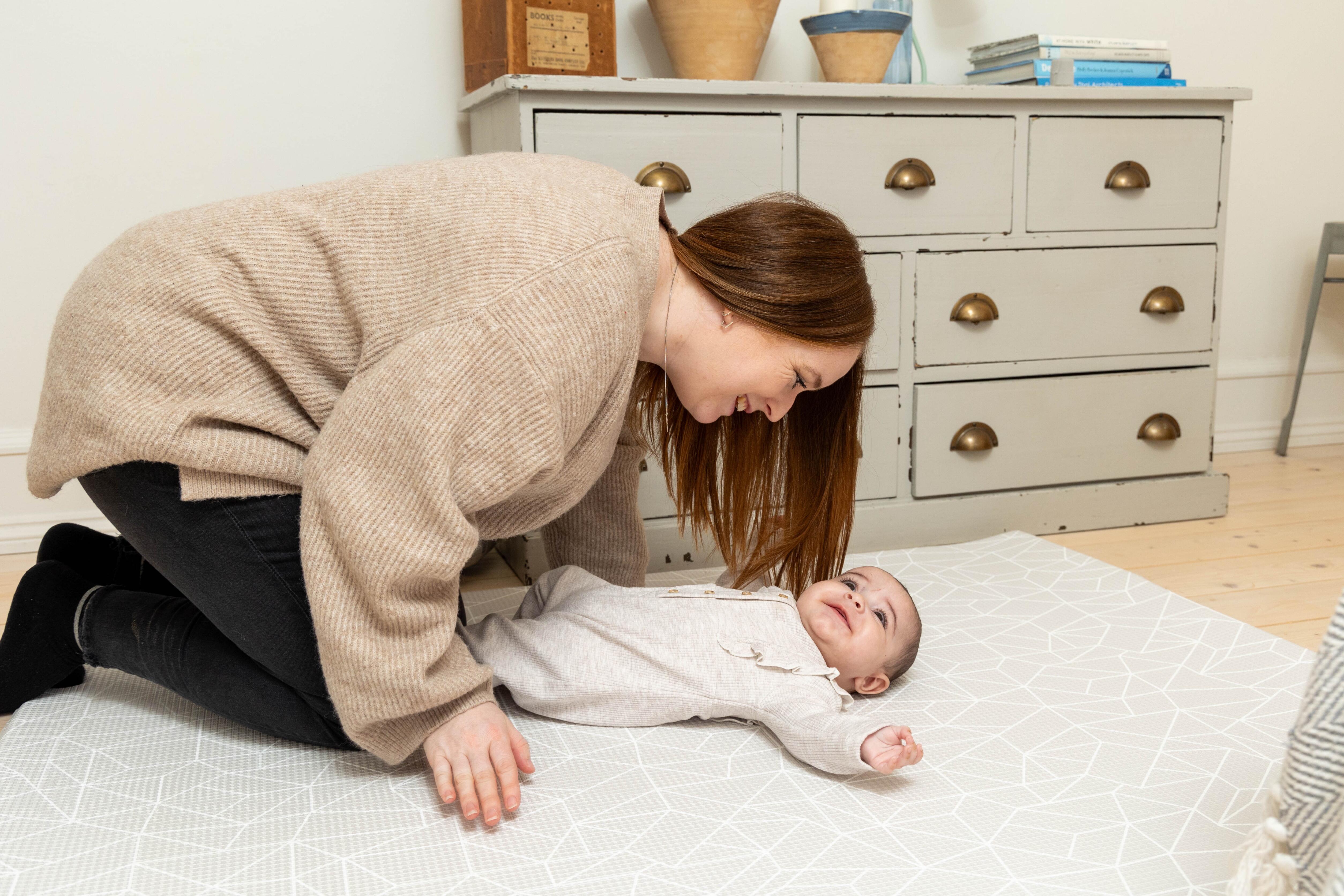 Greige reversible side of the Medium Nordic Explorer Playmat with easy-wipe finish