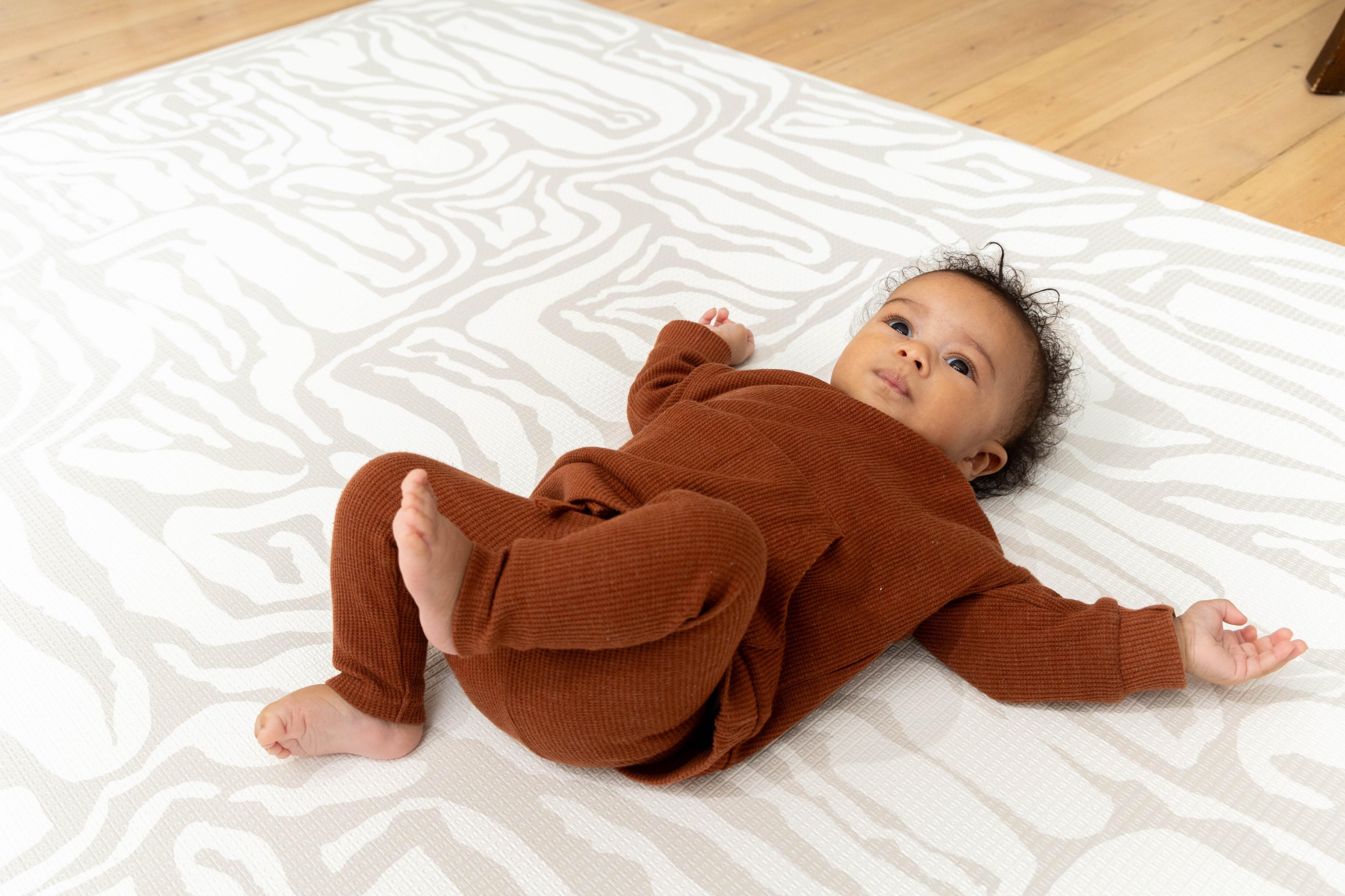 Pathway Playmat in Grey rolled neatly for compact storage