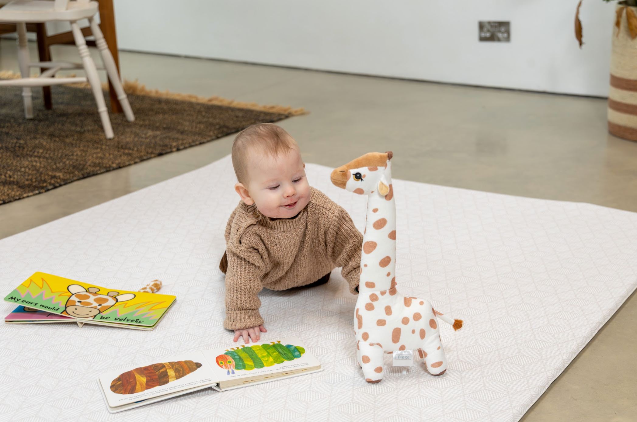 Reversible baby playmat in soft green tones for modern homes