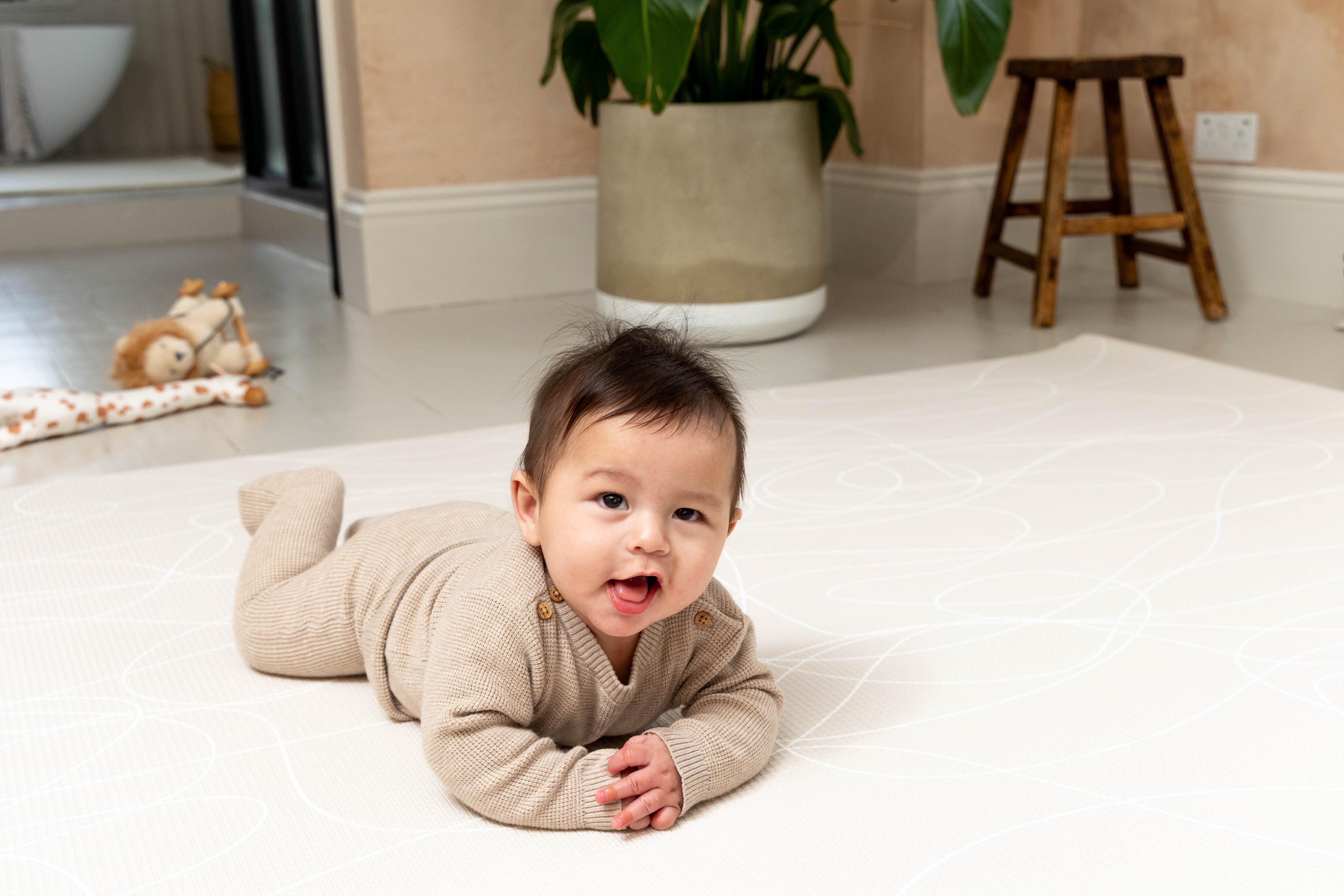 Close-up of the reversible Tiny Trekker Playmat texture and pattern