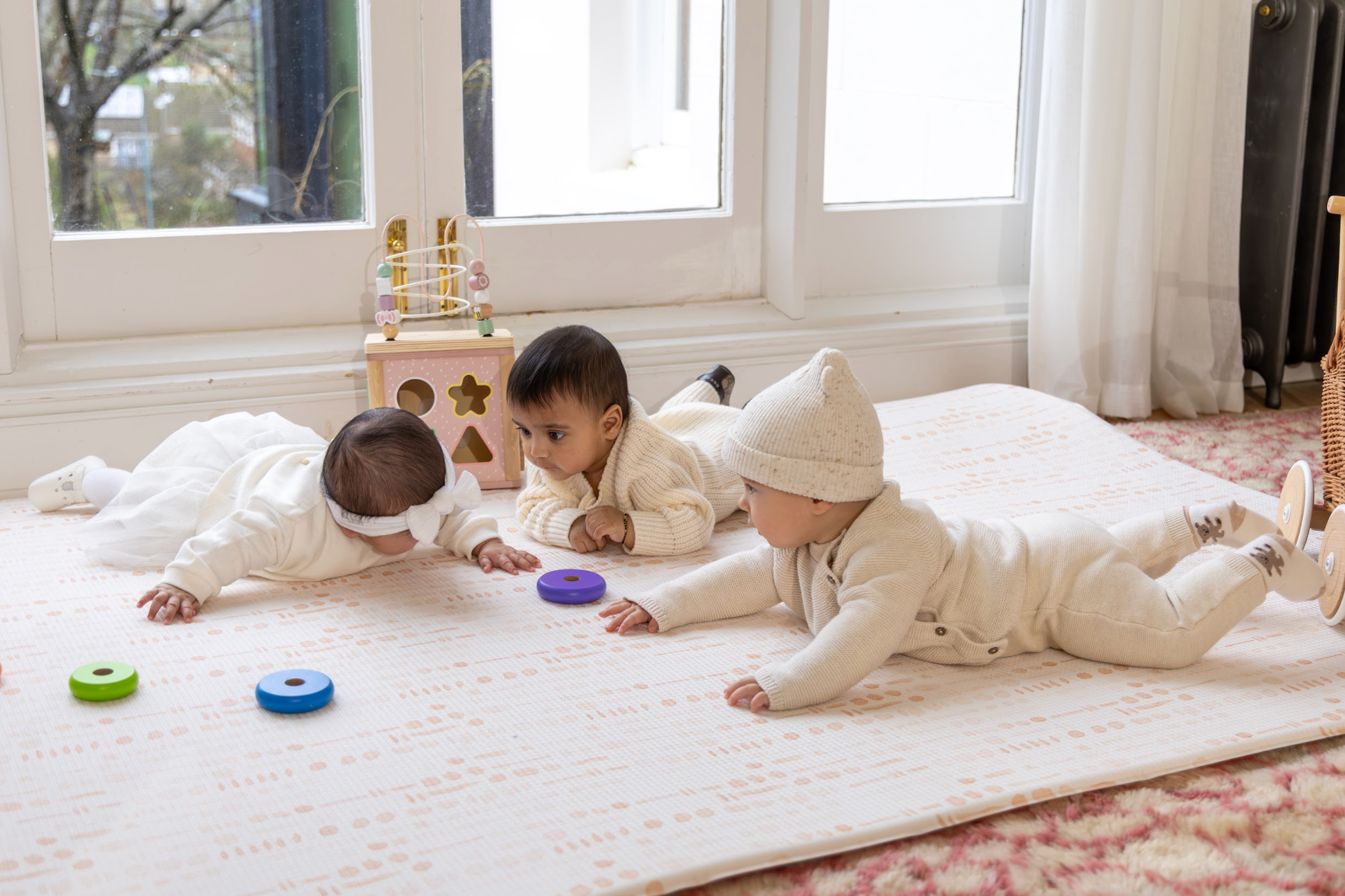 Babies Playing on the Saga Playmat
