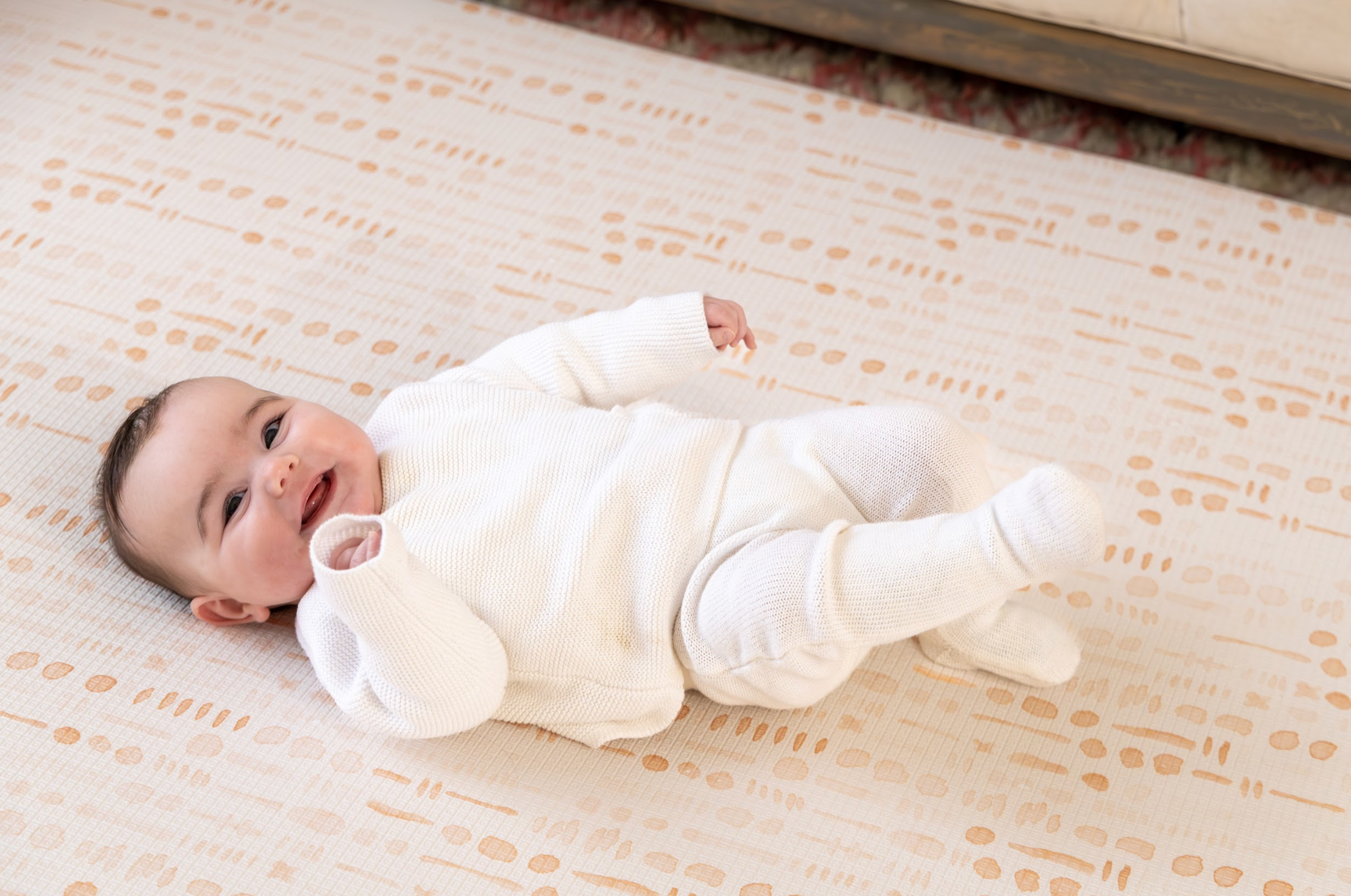 Close-up of Neutral Scandi patterned surface on Saga reversible playmat β wipe-clean non-toxic finish